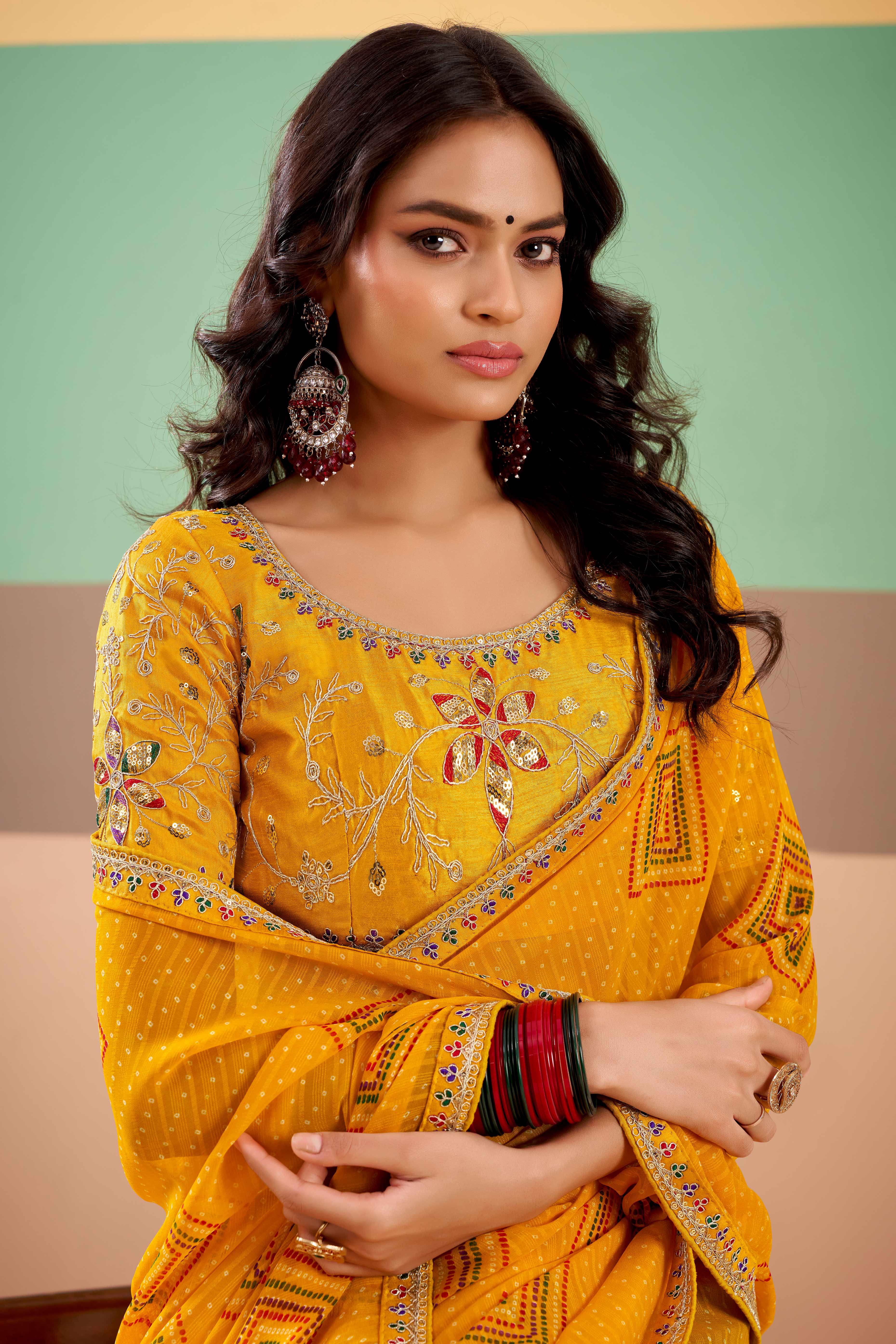 Charming Mustard Bandhani Printed Georgette Saree Adorned With Cording Embroidered Border