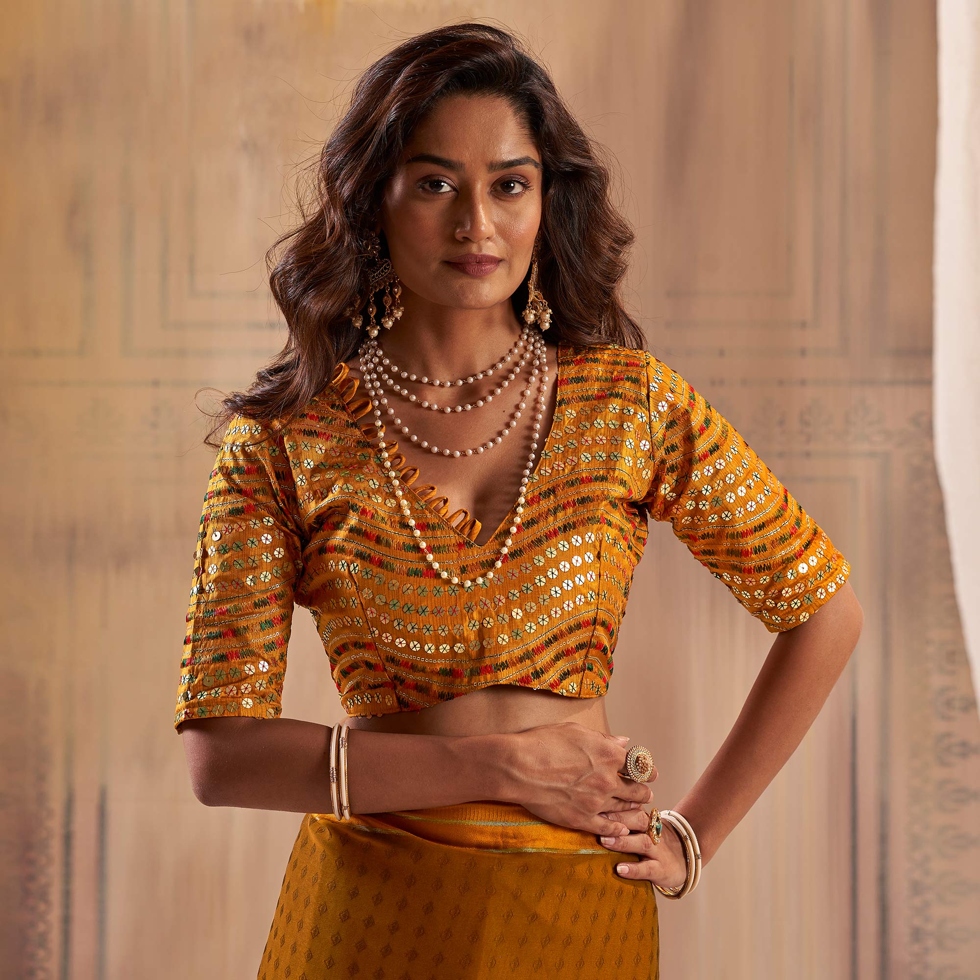Mustard Woven Georgette Saree With Tassels