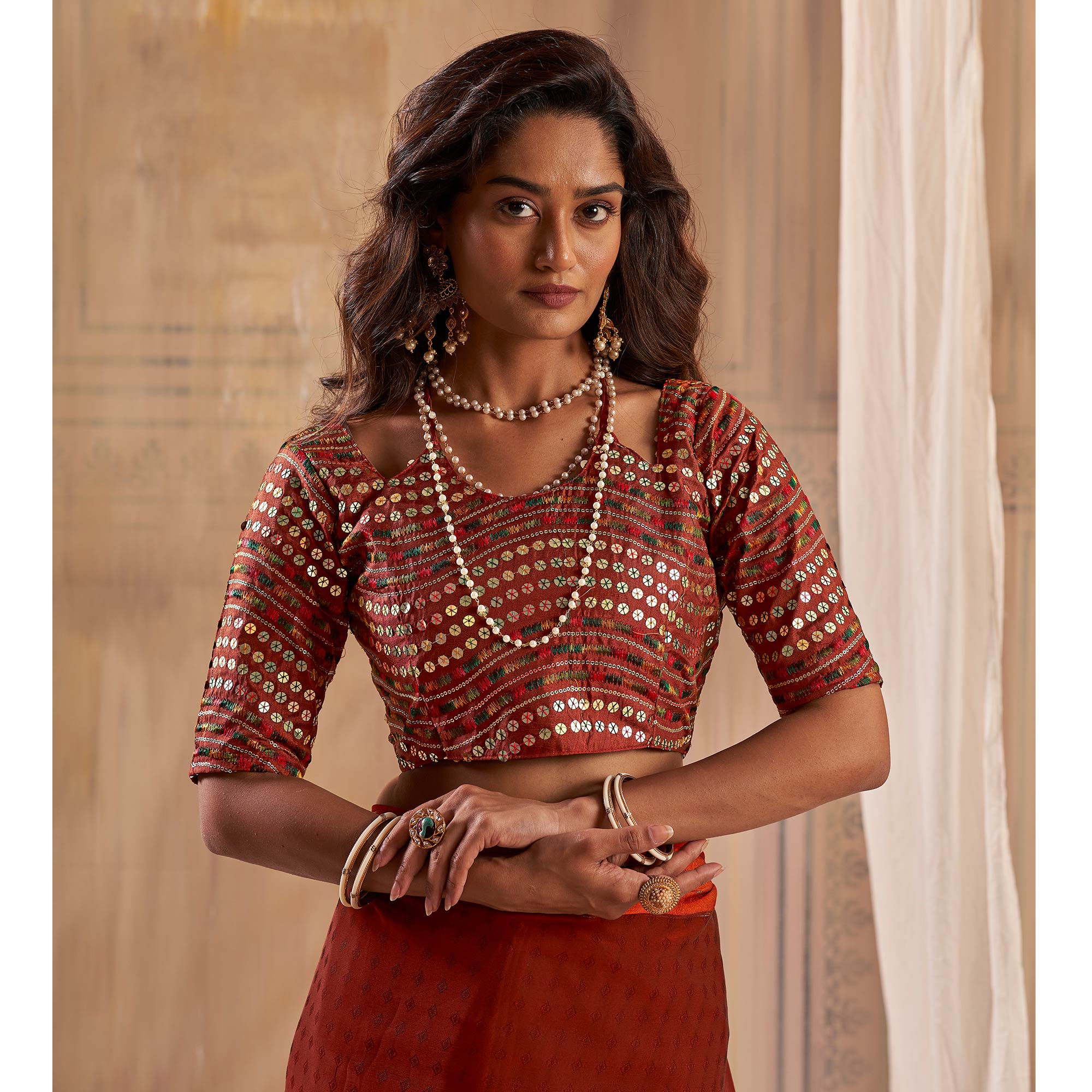 Rust Woven Georgette Saree With Tassels
