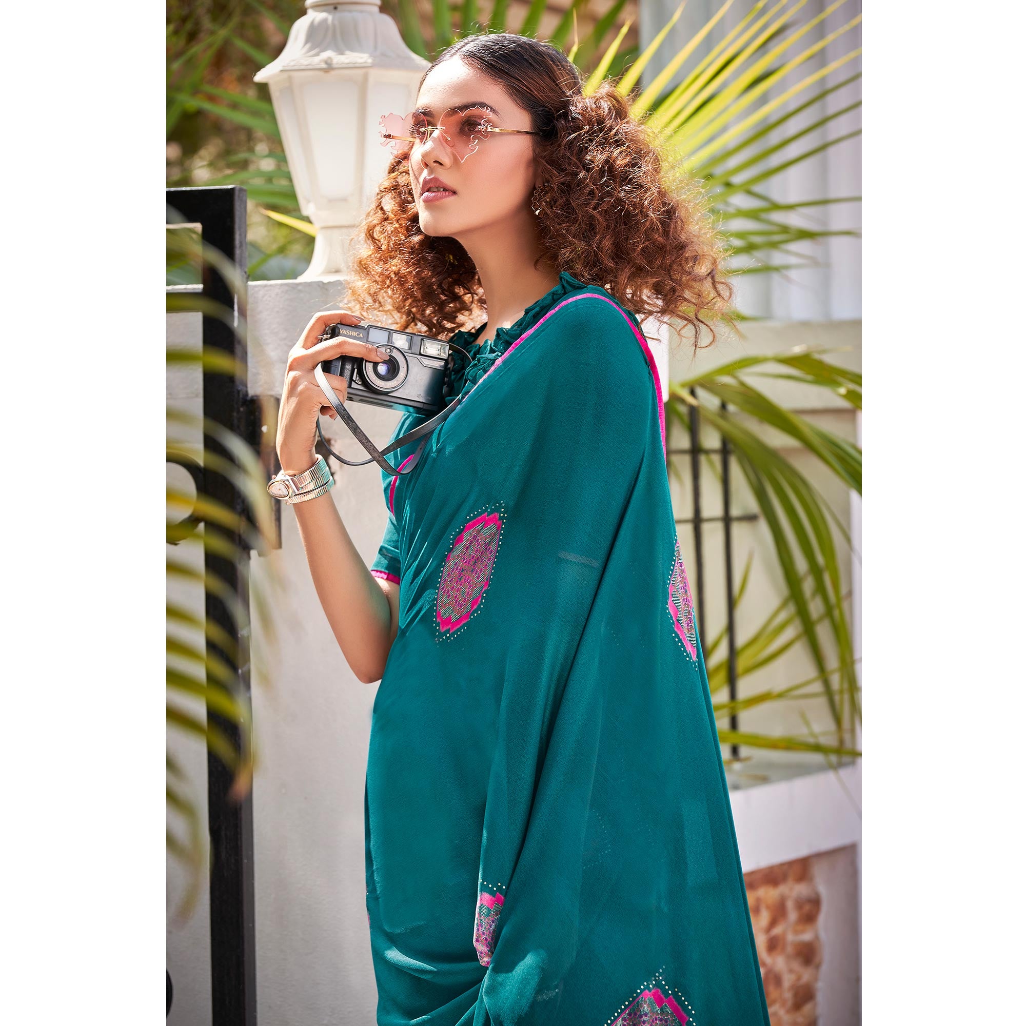 Teal Foil Printed Georgette Saree With Tassels