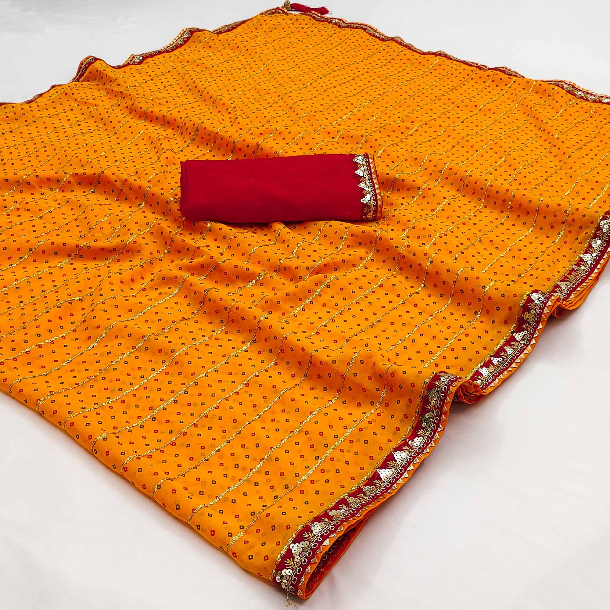 Charming Mustard Bandhani Printed Georgette Saree With Glittering Sequins & Zari Border