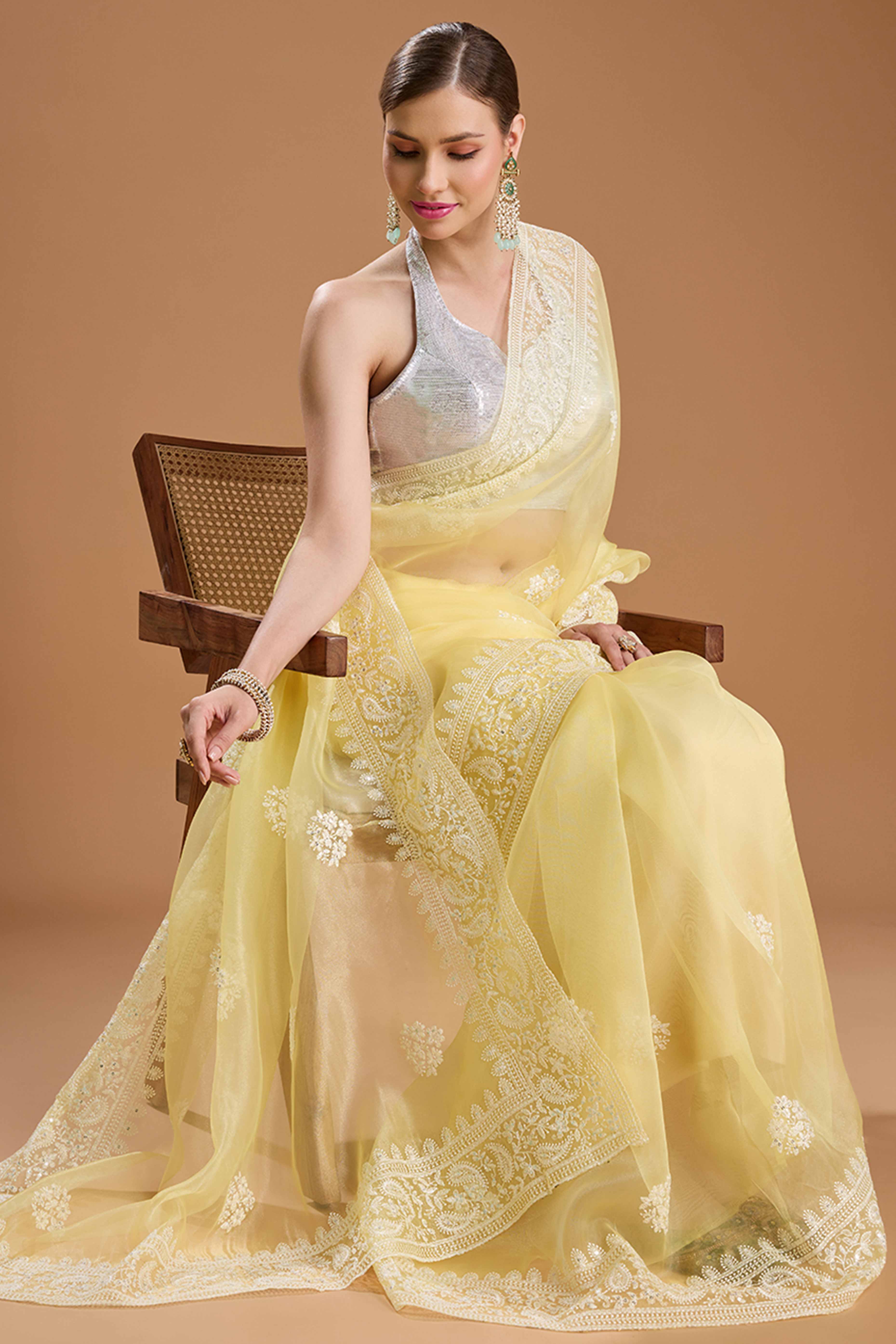 Light Yellow Net Saree Enhanced with Elegant Sequins Embellishments