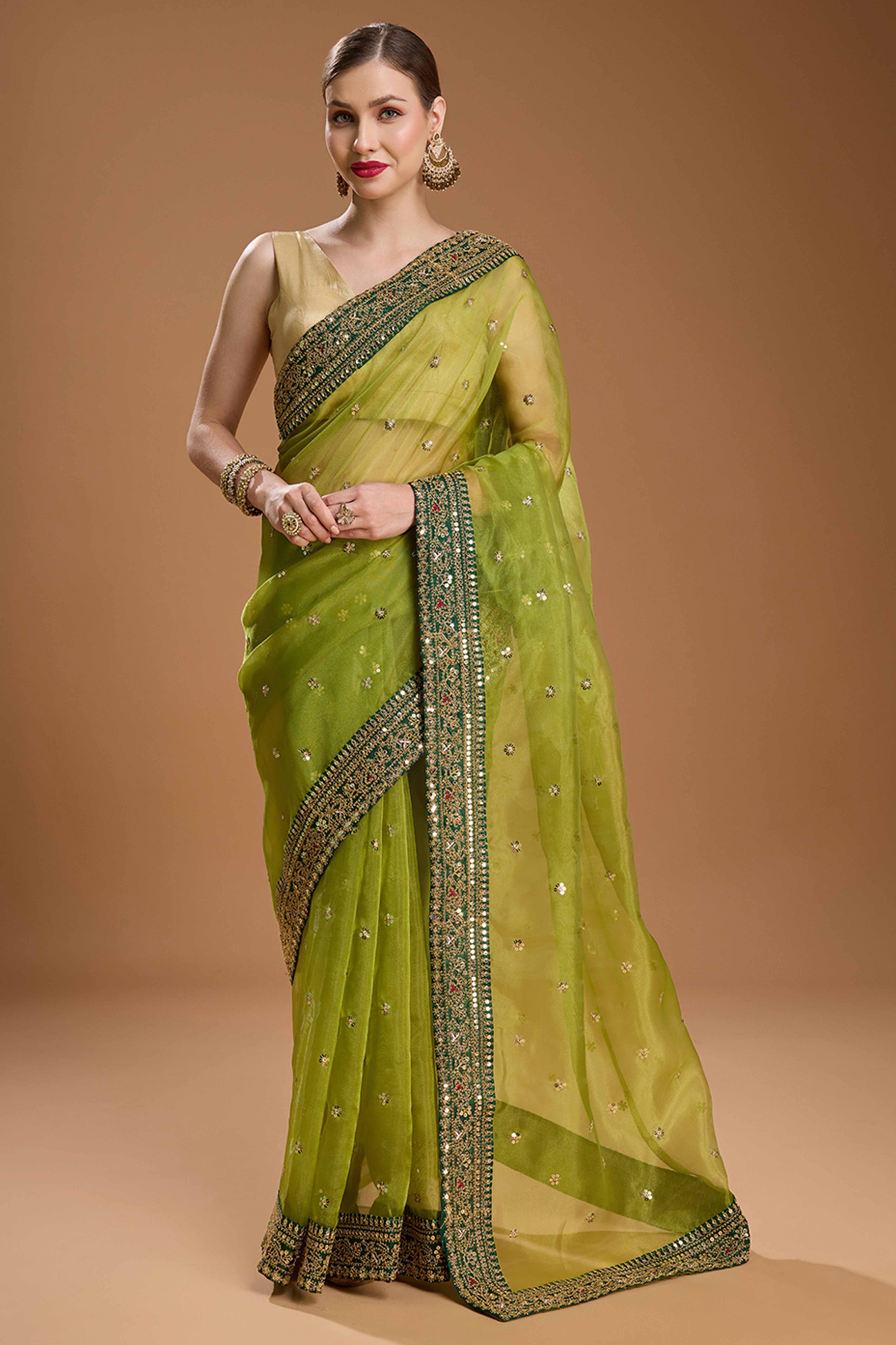 Green Organza Saree Enhanced with Elegant Sequins Embellishments