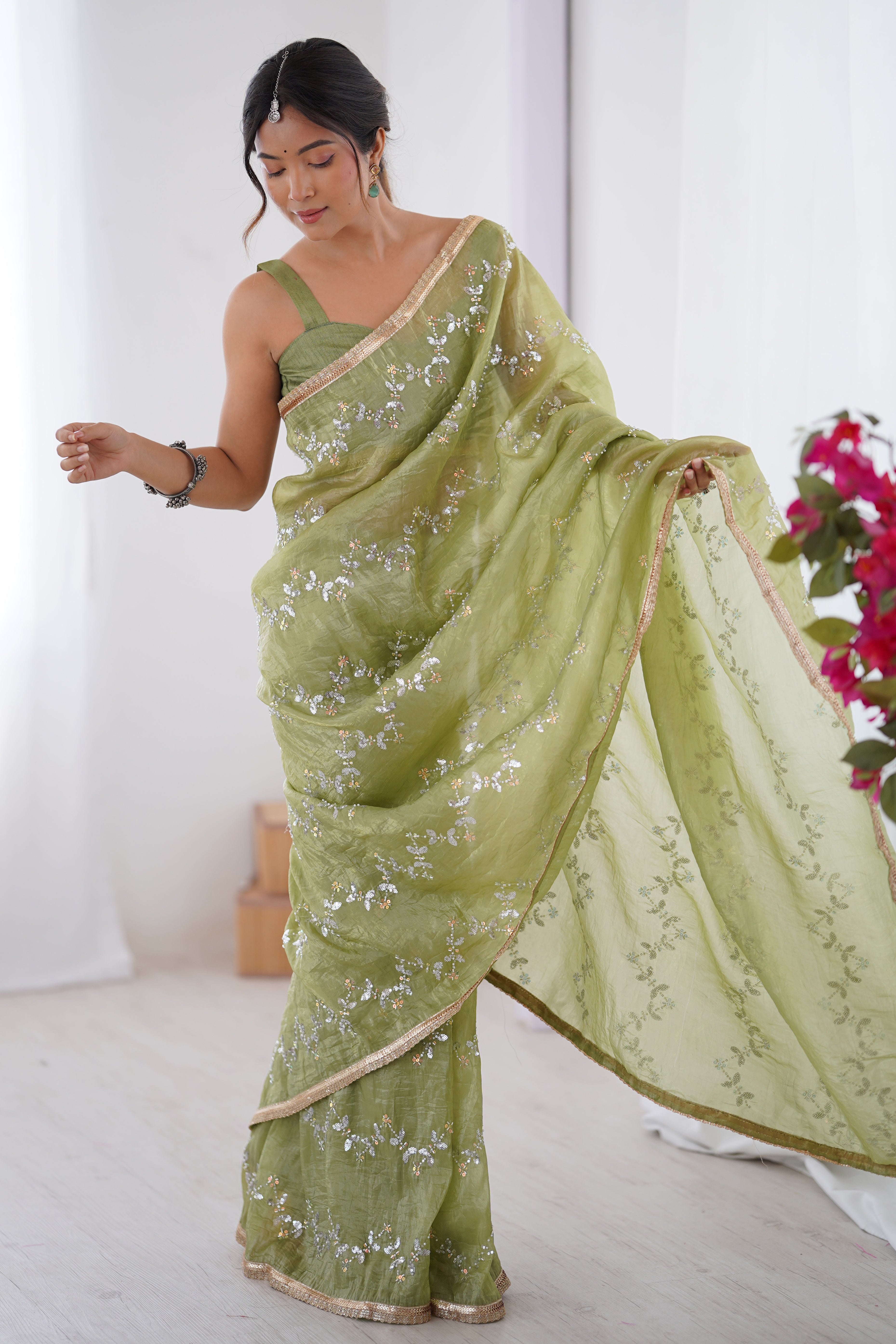Dazzling Pista Green Organza Saree Accented with Sequin, Bead & Stone Work and Delicate Lace Detailing