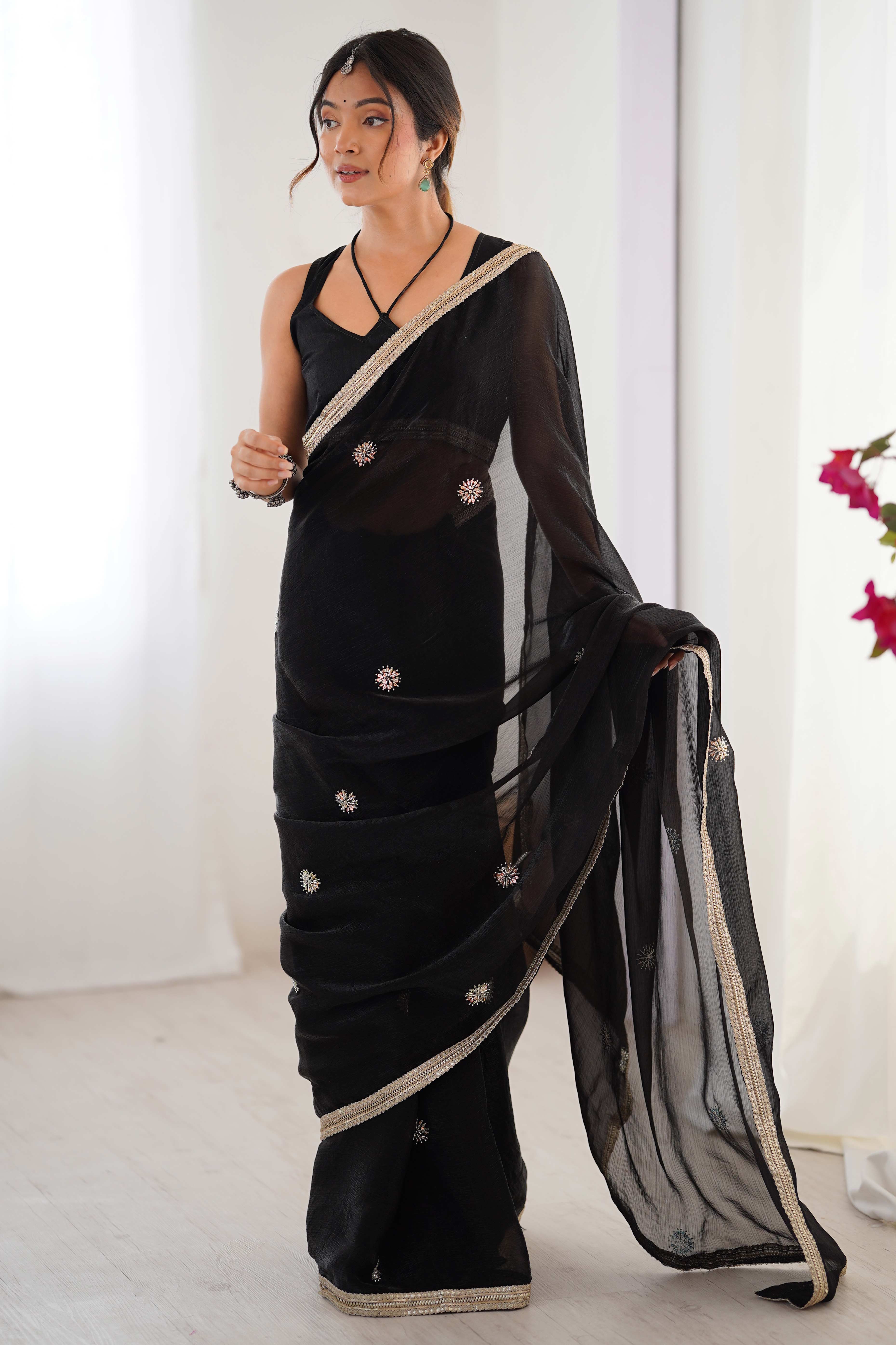 Elegant Black Organza Saree with Delicate Floral Embellishments and Lace Border