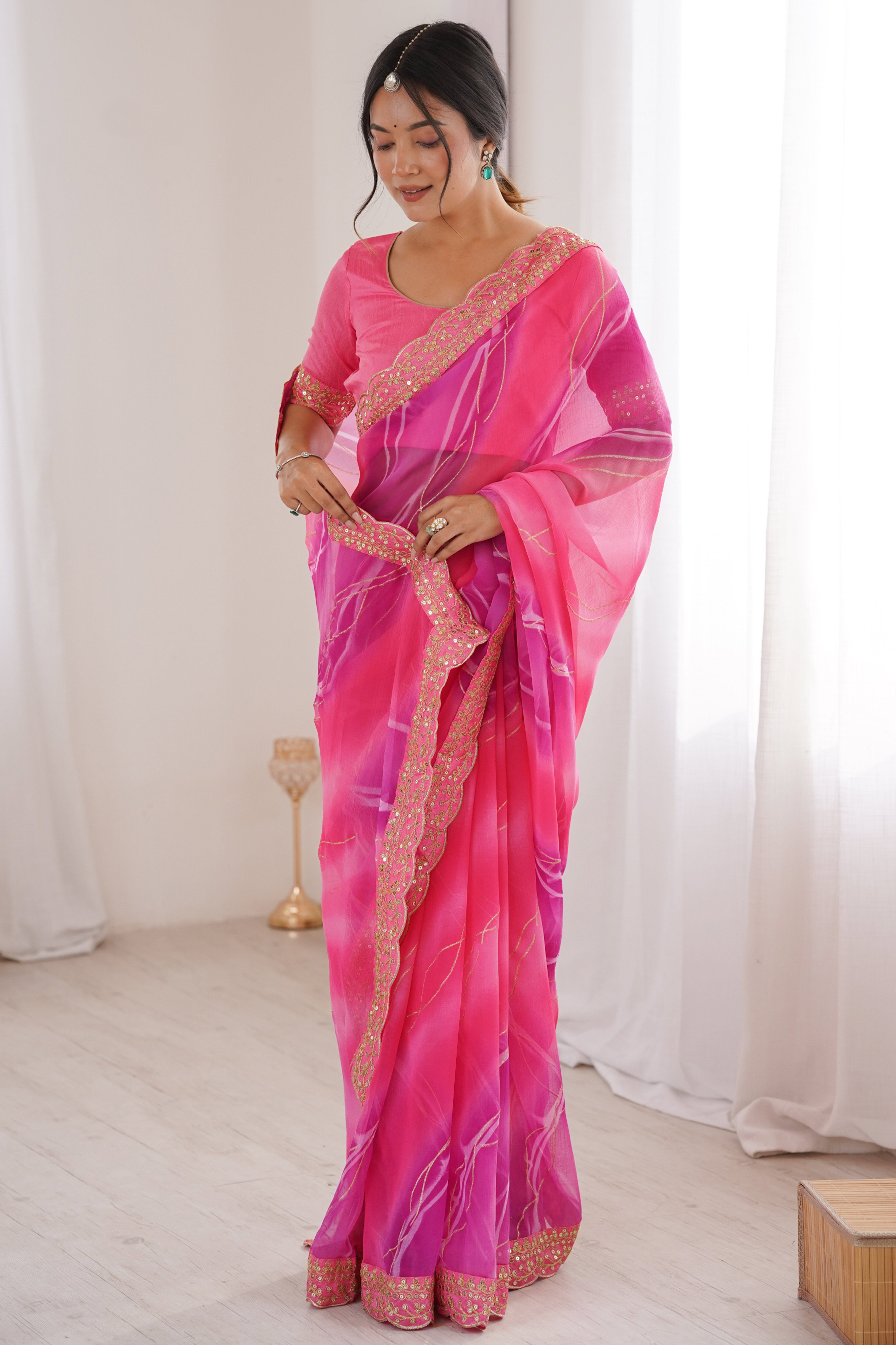 Graceful Pink Foil Print Georgette Saree Featuring A Luxurious Cording Sequins Embroidered Border