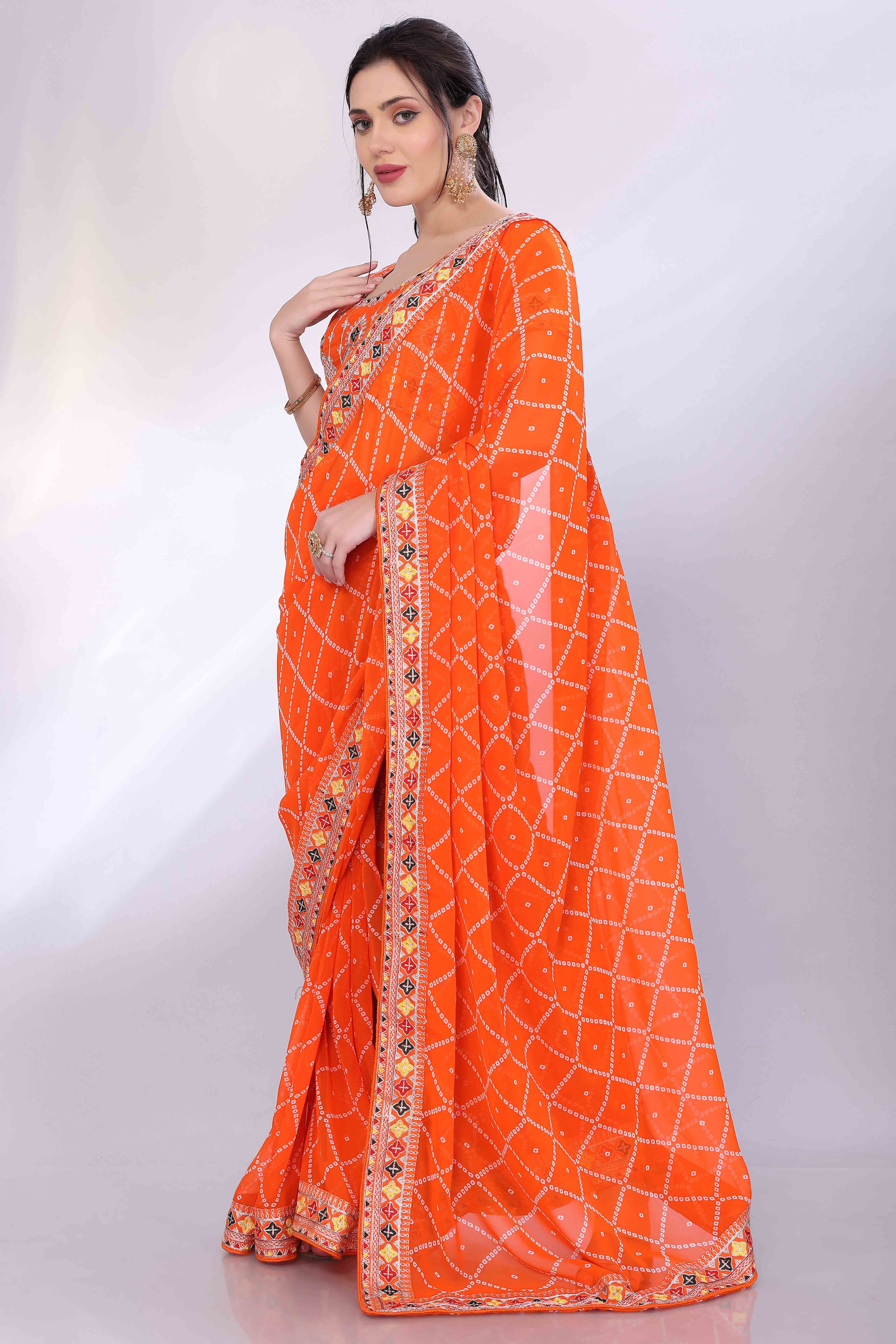 Orange Bandhani Printed Georgette Saree Framed With Elegant Embroidered Border