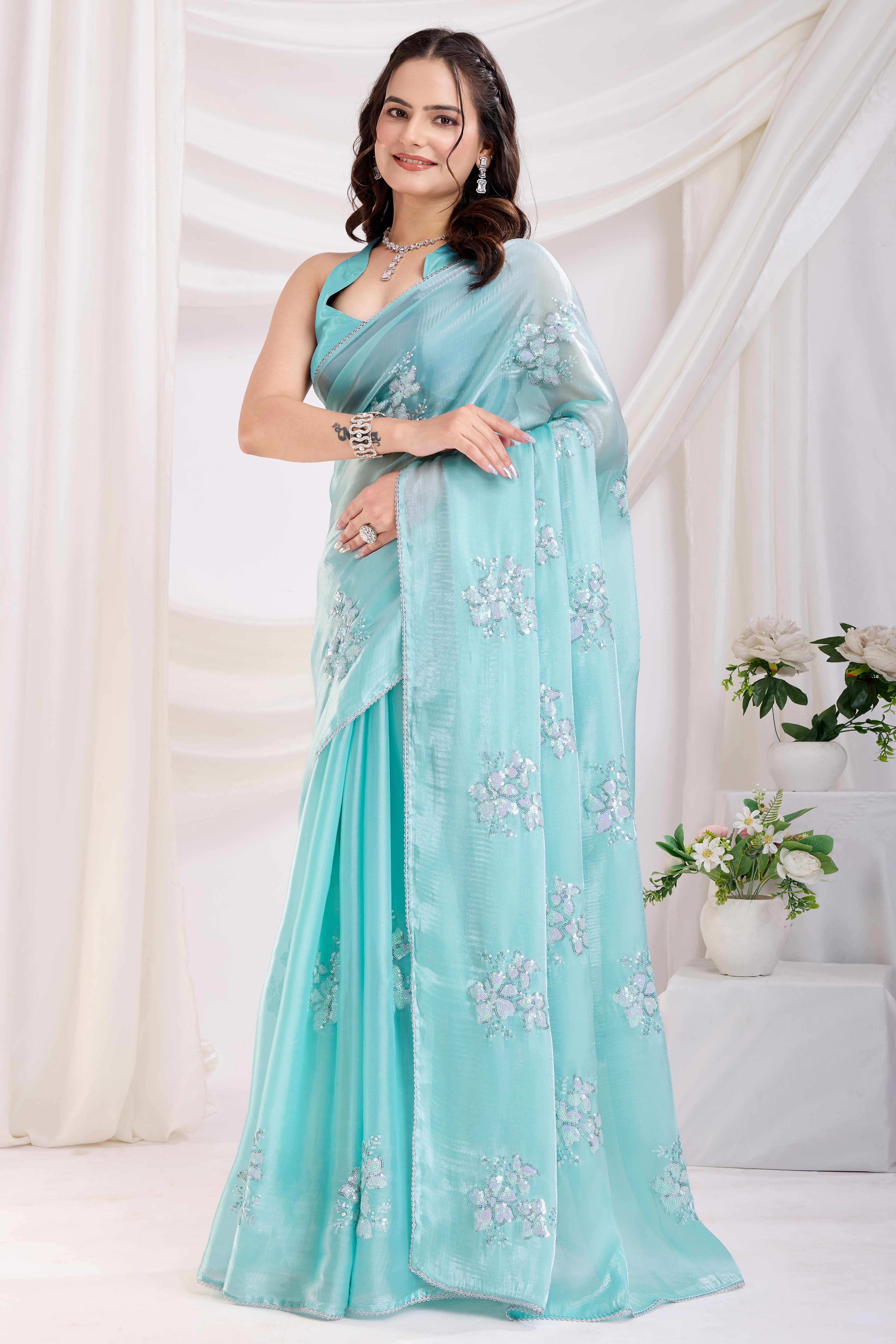 Turquoise Saree With Exquisite Floral Sequins Embroidery On Luxe Jimmy Choo Silk Blend