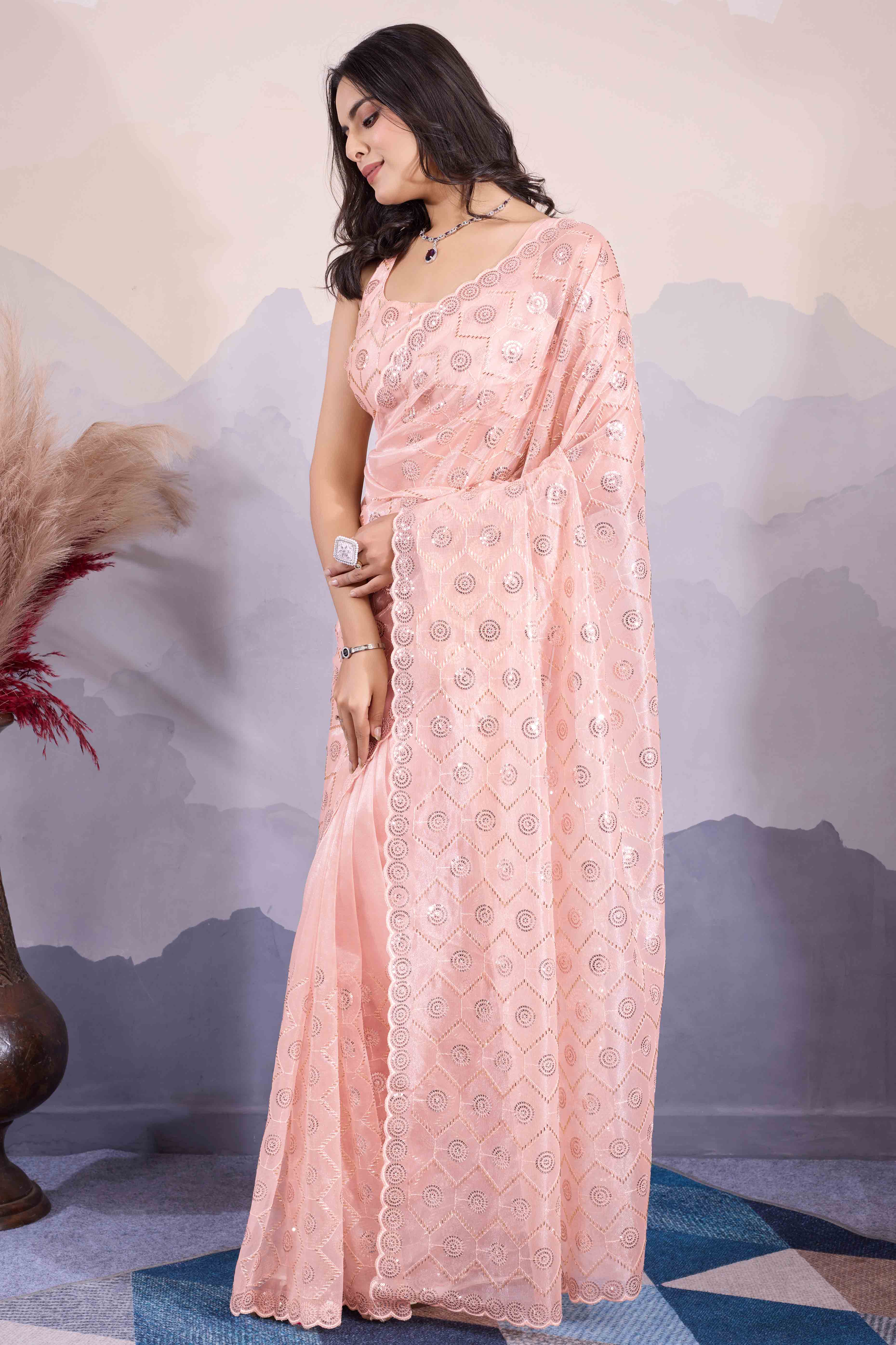 Peach Sequins Embroidered Twill Net Saree