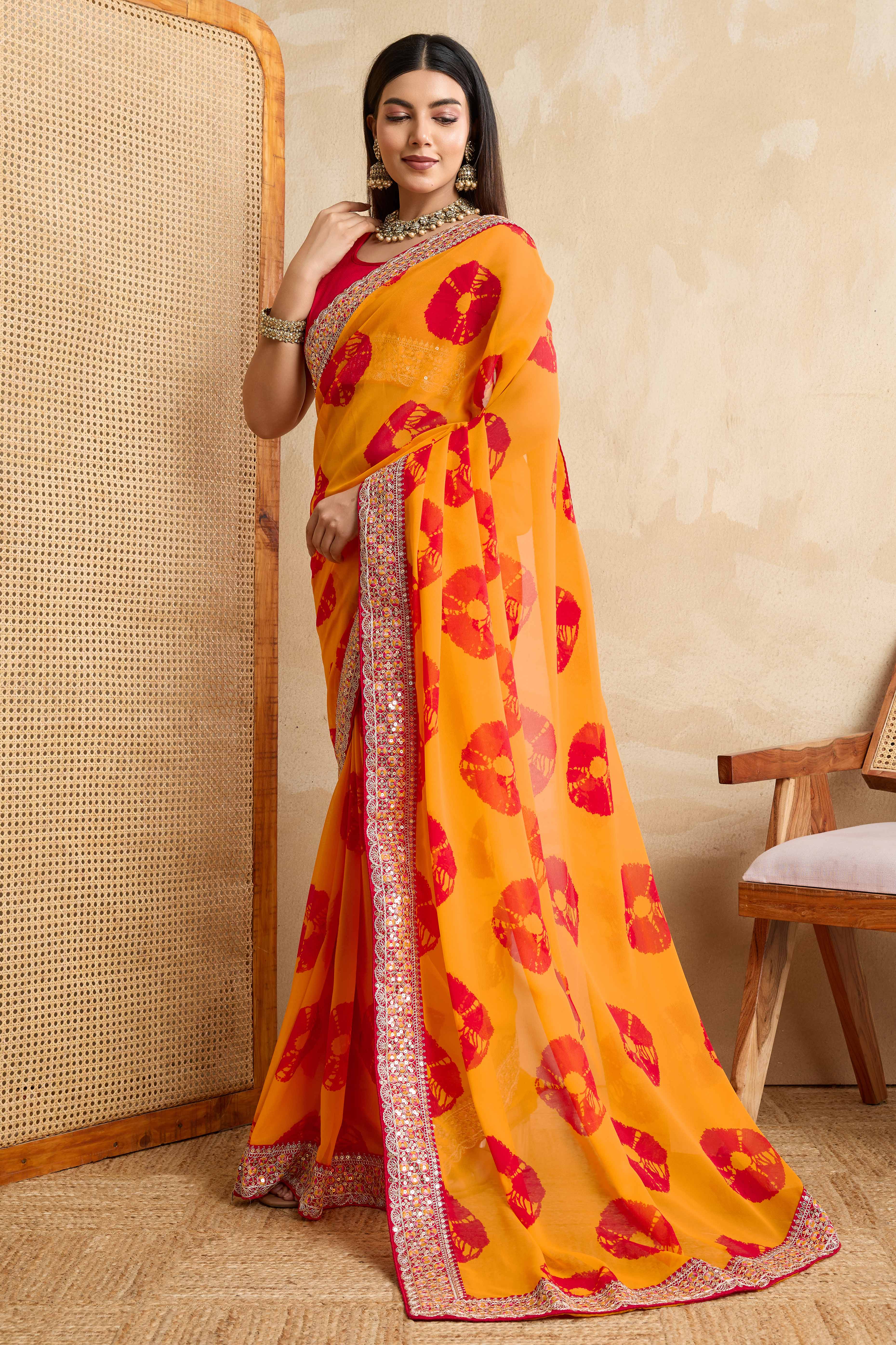 Bright Orange Georgette Saree with Contemporary Tie-Dye Patterns and Classic Lace Work Finish