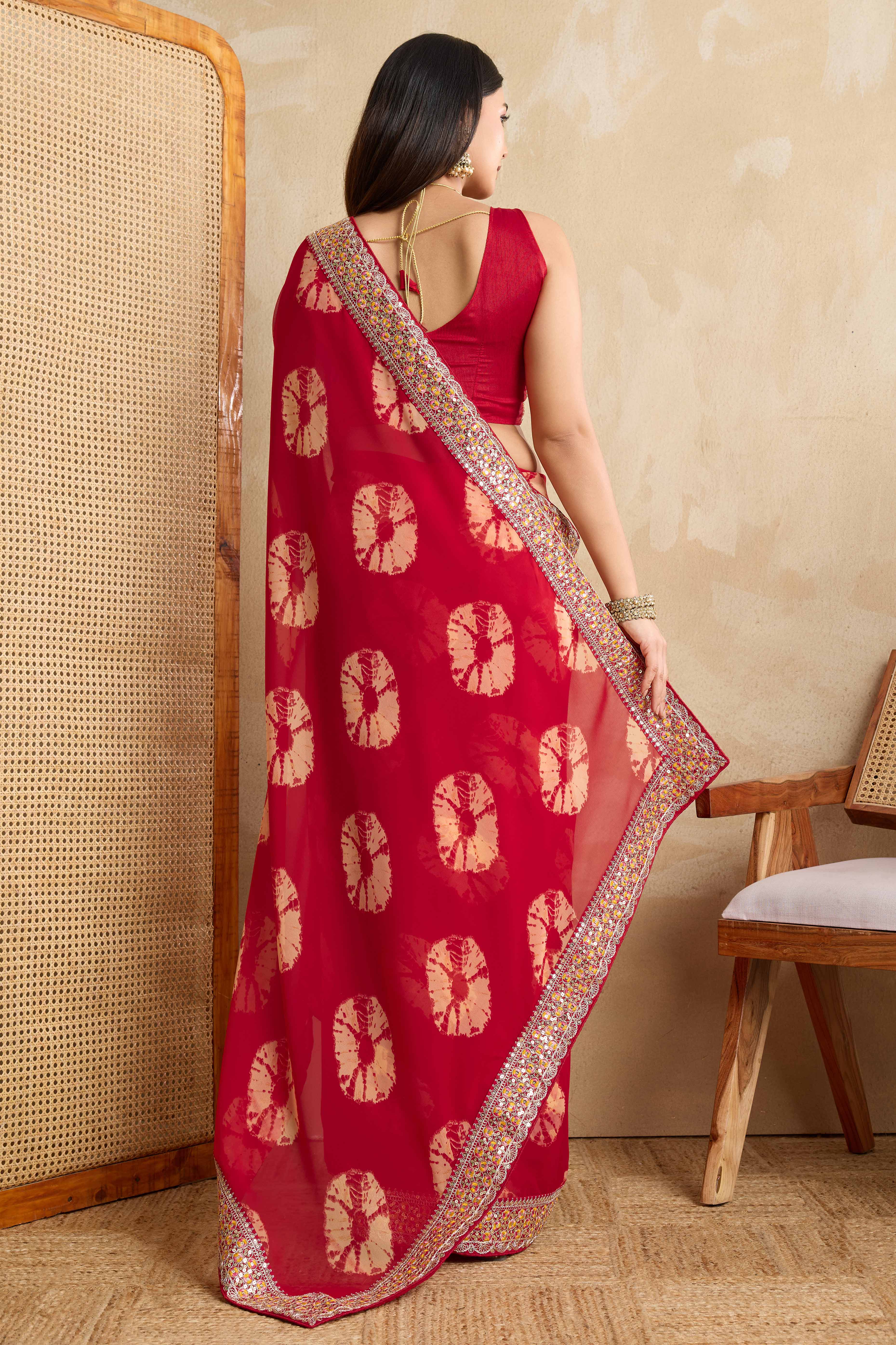 Red Georgette Saree with Contemporary Tie-Dye Patterns and Classic Lace Work Finish
