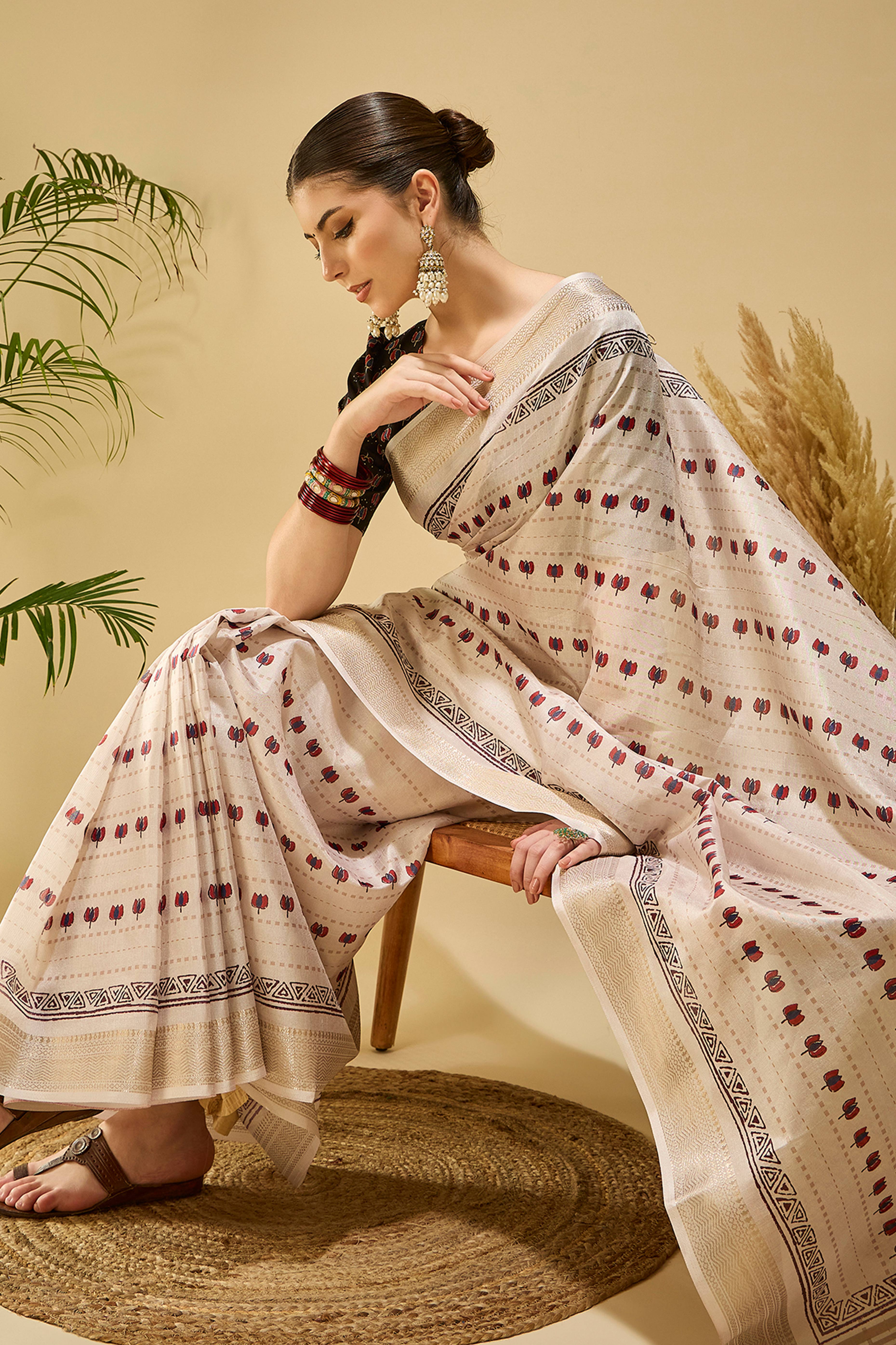 Refined Cream Floral Patterned Katki Cotton Silk Saree Highlighted By Tassel Pallu