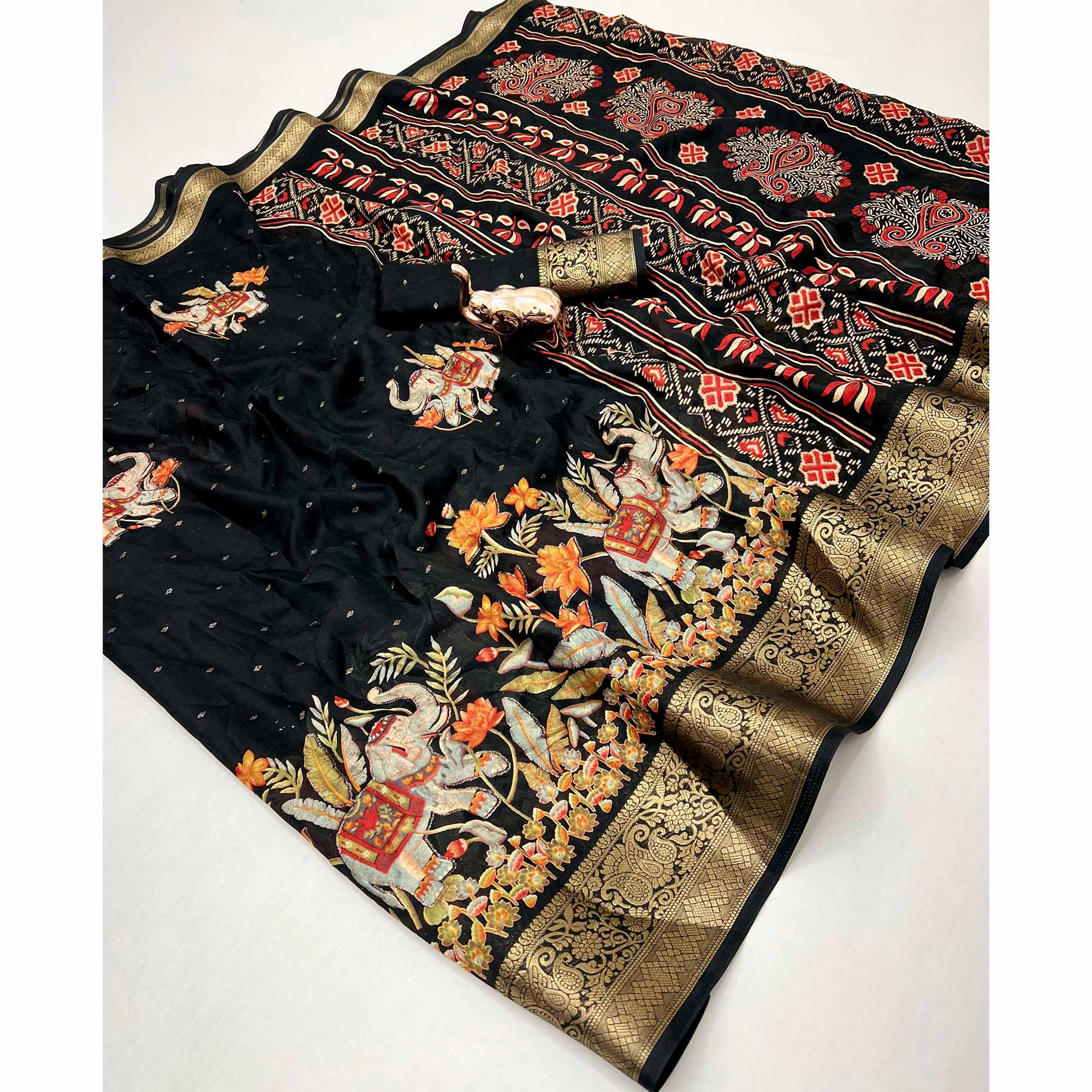 Elegant Black Elephant & Floral Printed Georgette Saree Accented With Gleaming Weaving Zari Border