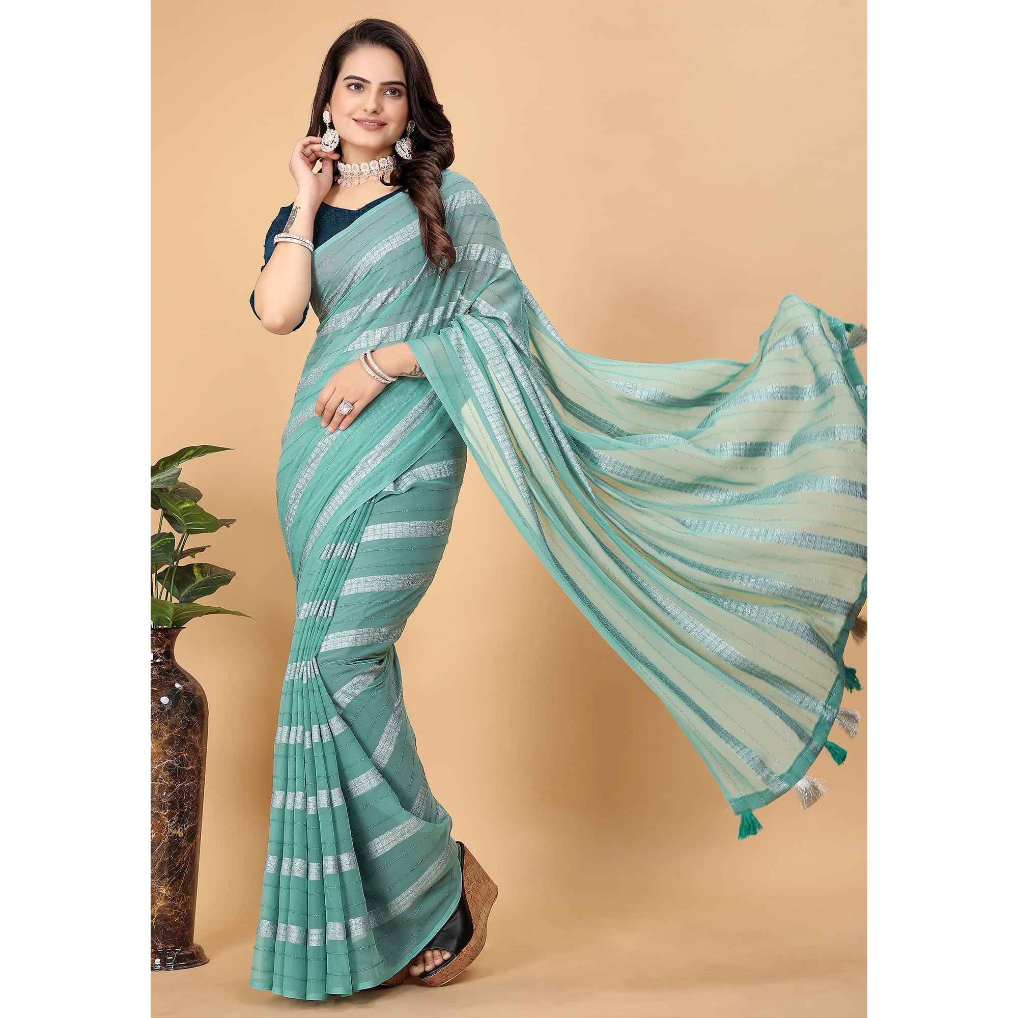 Sea Green Zari Striped Georgette Saree With Tassels