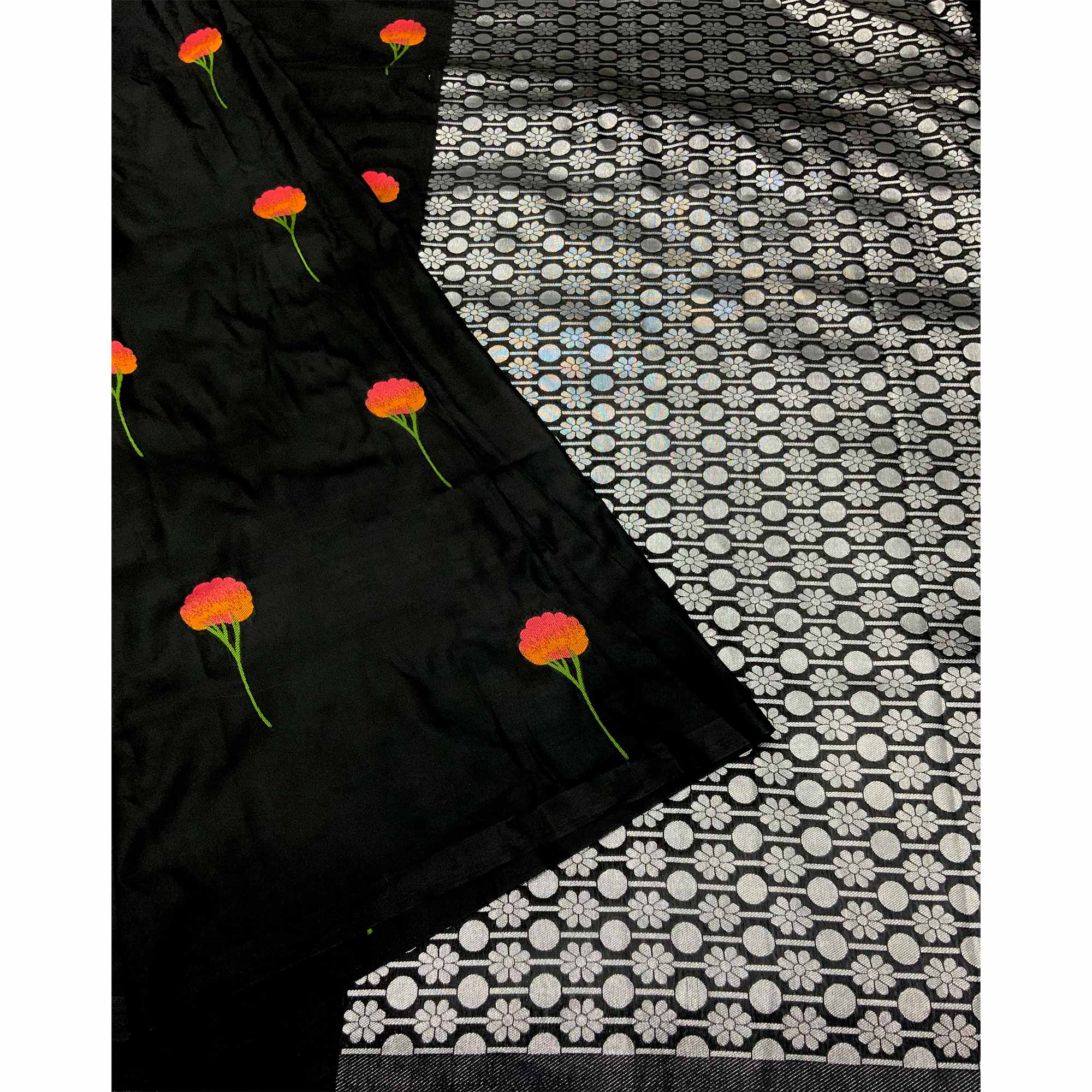 Graceful Black Banarasi Silk Saree With Floral Zari Weaving & Tassel Border