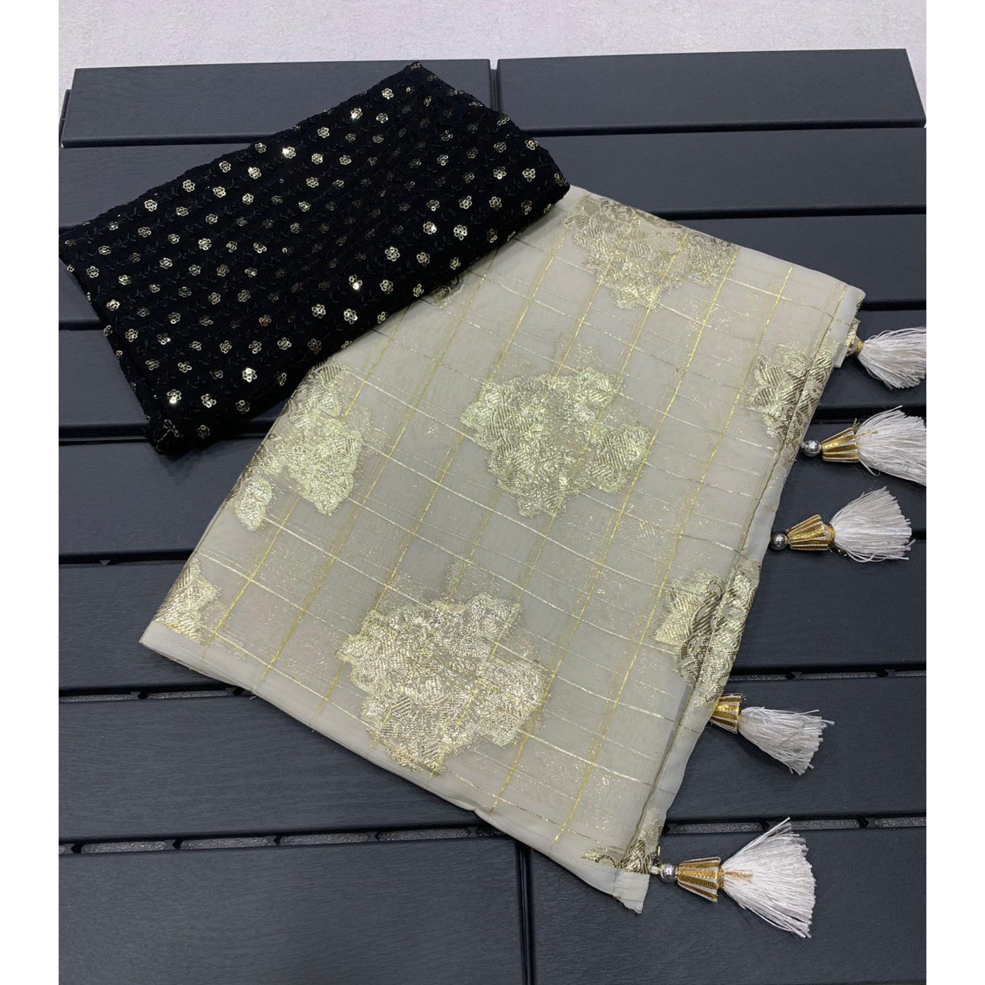 White Floral Woven Georgette Saree With Tassels