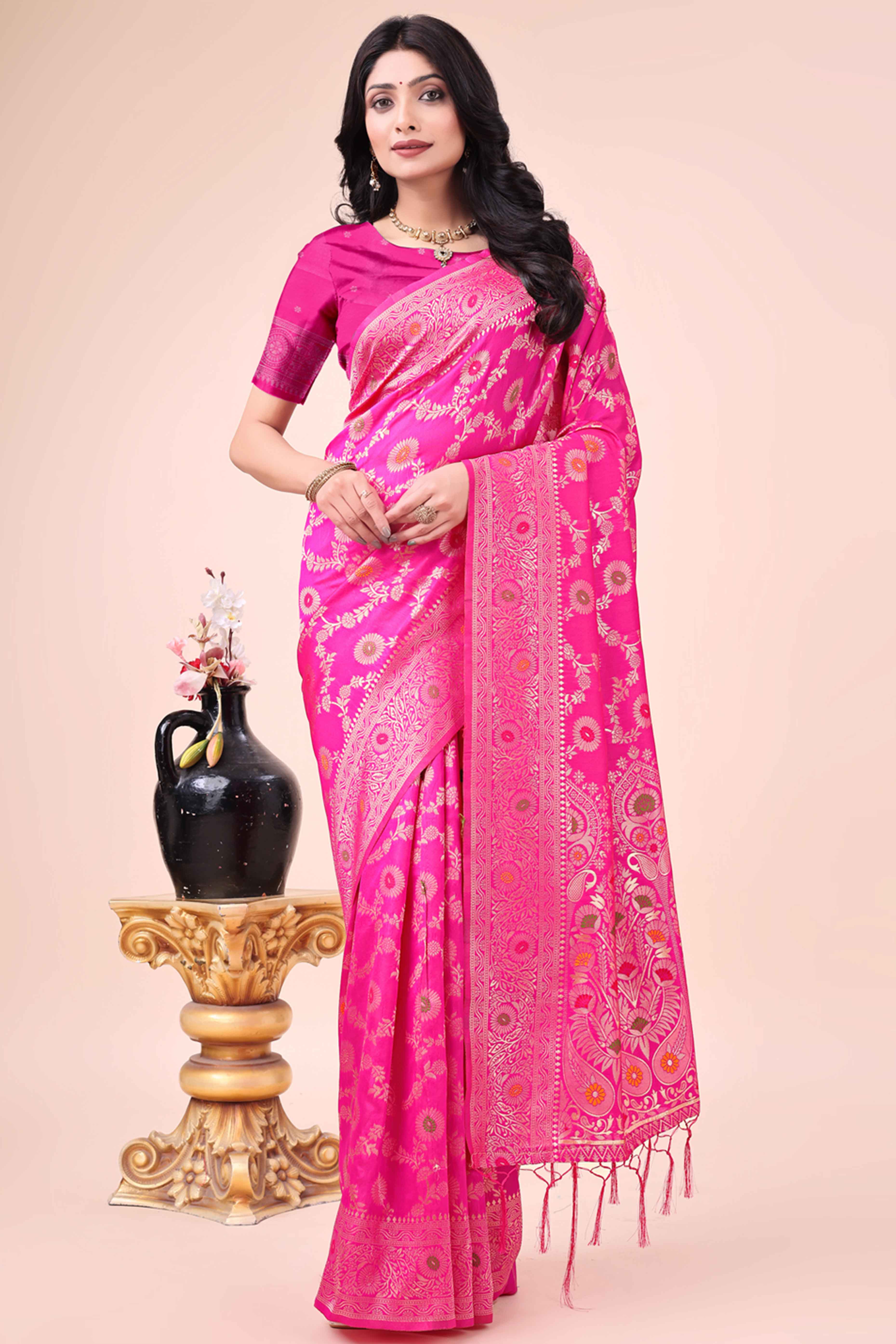 Rani Pink Banarasi Silk Saree With Intricate Floral Weave & Elegant Tassel Accents