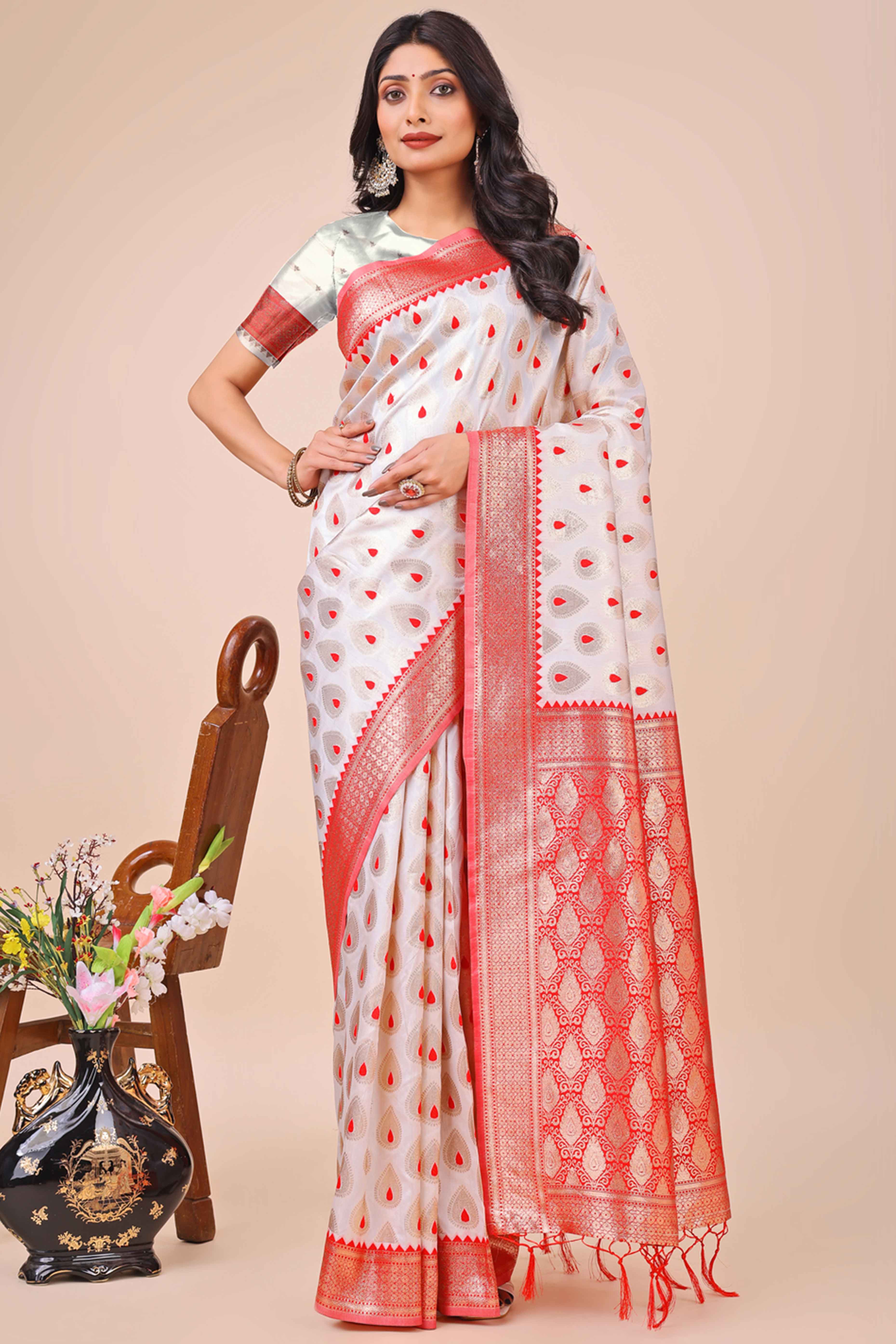 White Banarasi Silk Saree With Intricate Floral Weave & Elegant Tassel Accents