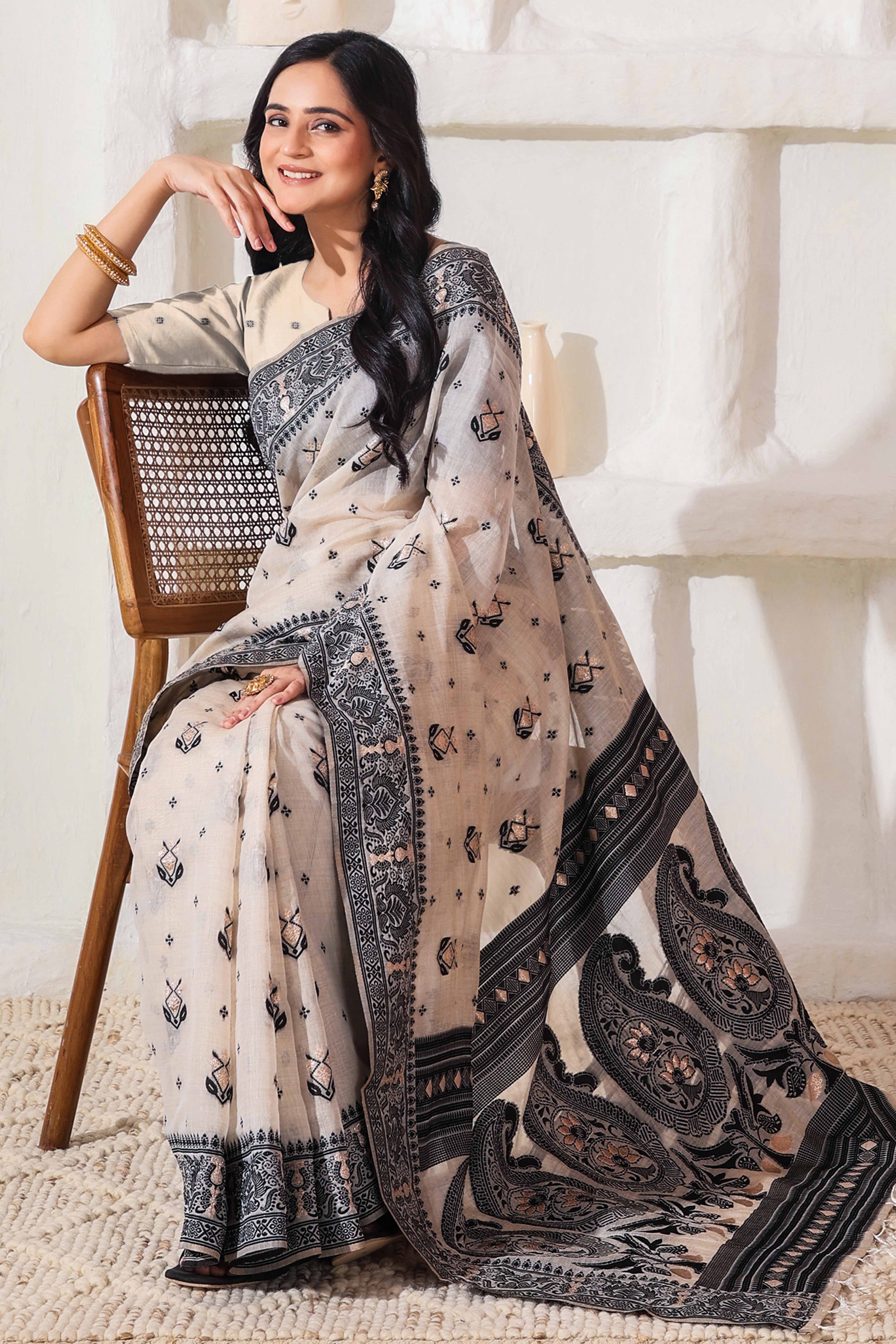 Classic Cream & Black Linen Cotton Saree Featuring Intricate Zari Weaving & Tassel Pallu