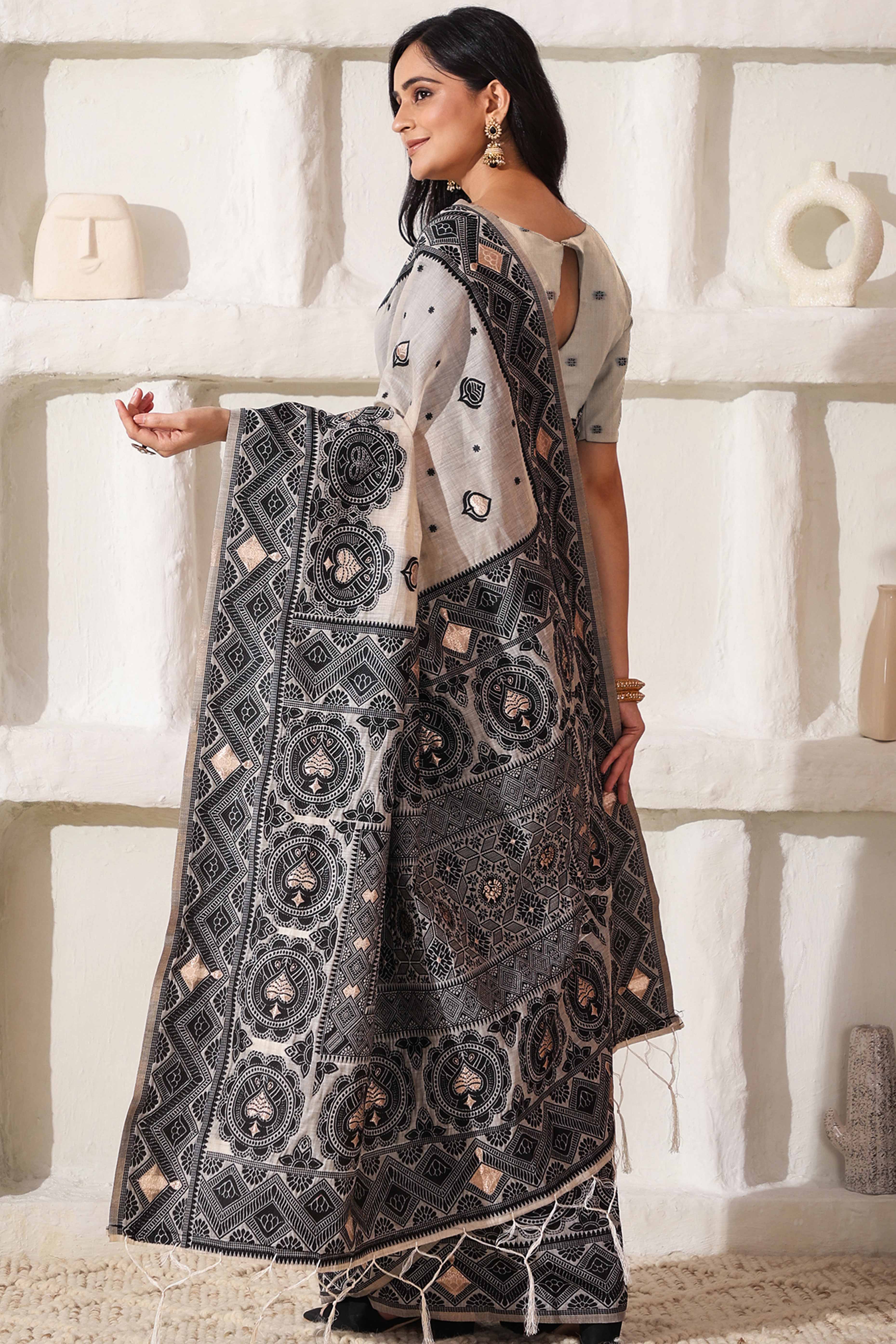 Timeless Cream & Black Saree In Linen Cotton With Rich Zari Weaving And Tassel Pallu