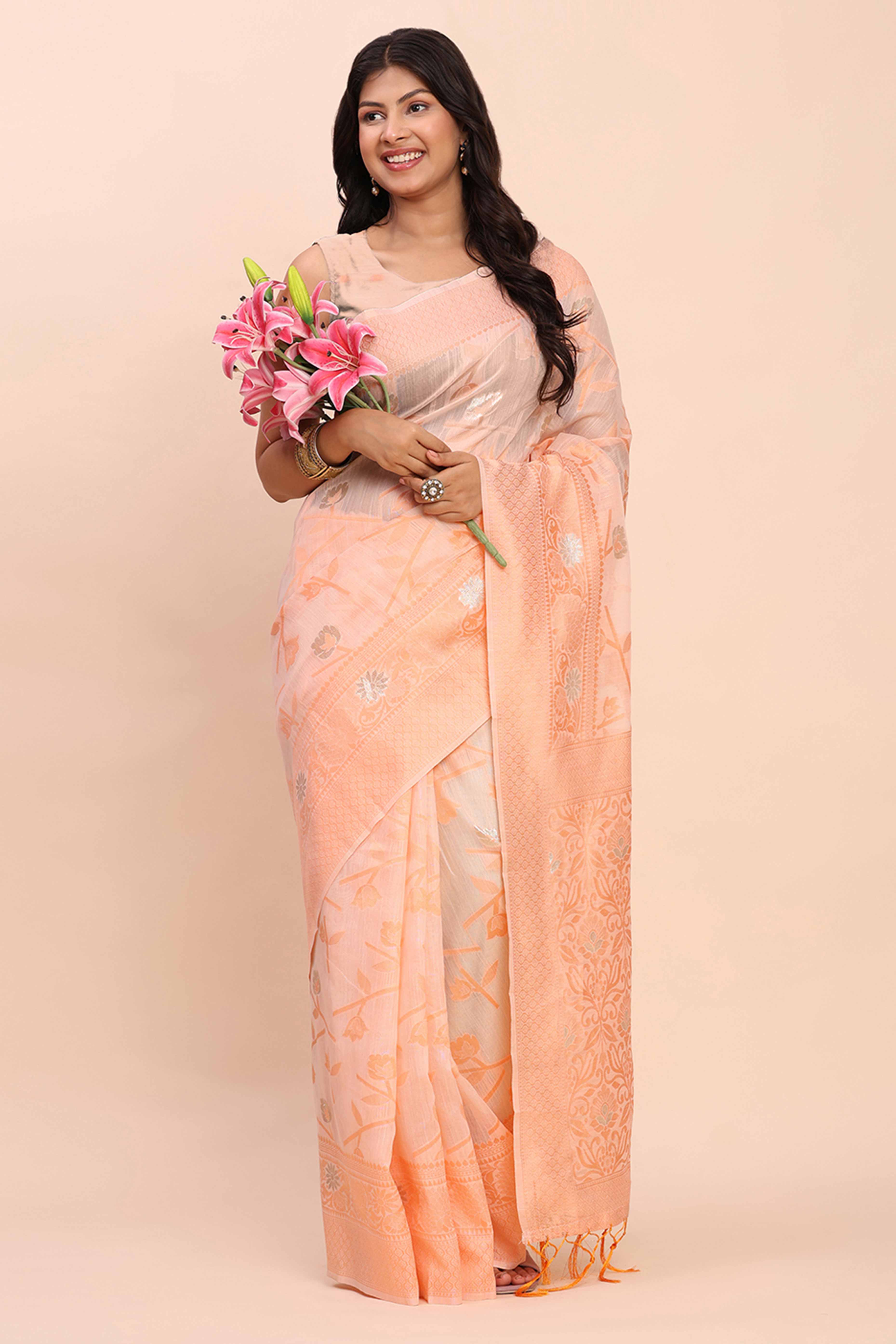 Peach Floral Linen Cotton Saree Accented With Zari Weaving & Tassel Pallu Elegance