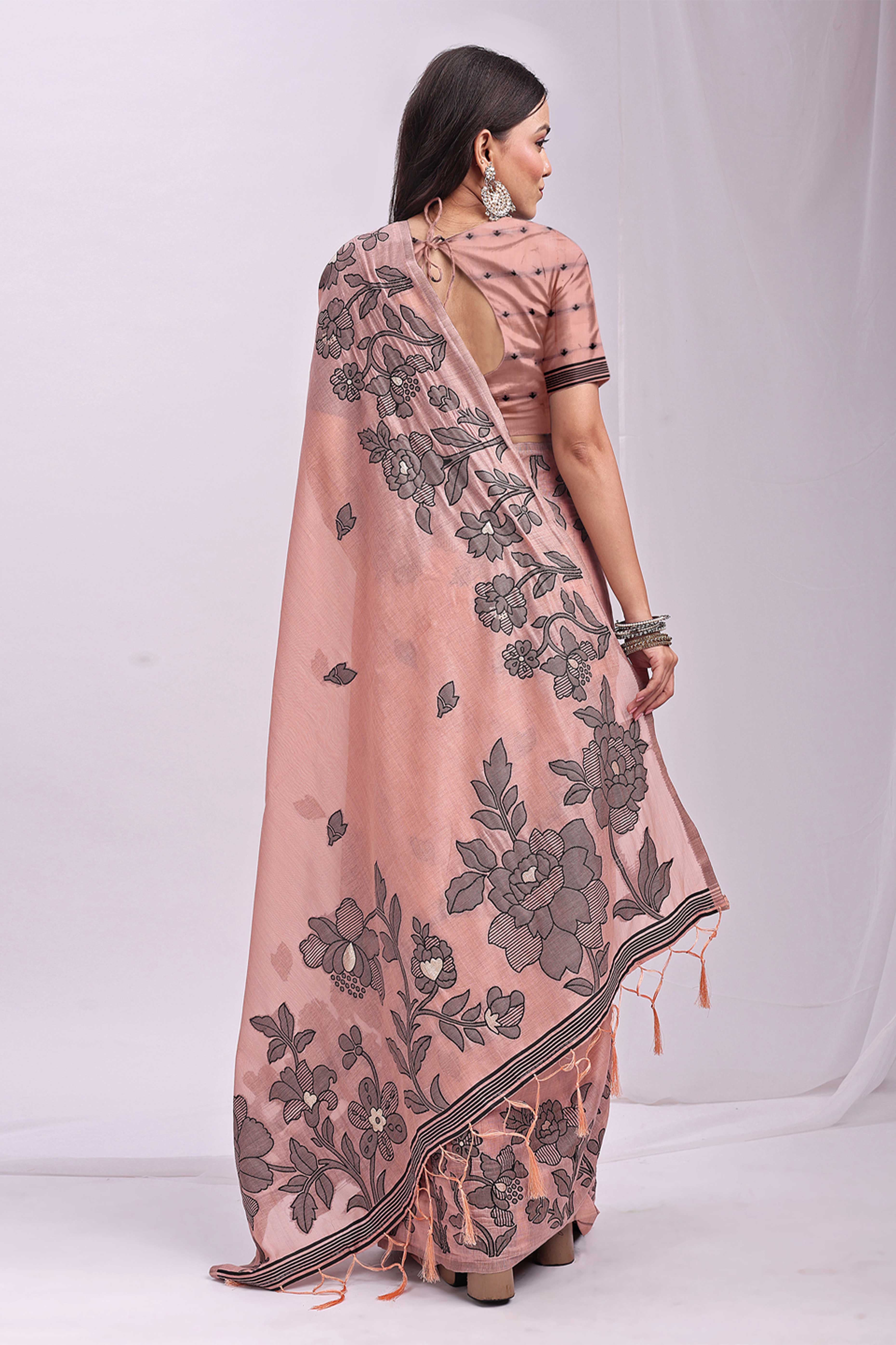 Peach Ethnic Saree in a Linen Cotton Blend Adorned with Floral Weave Designs
