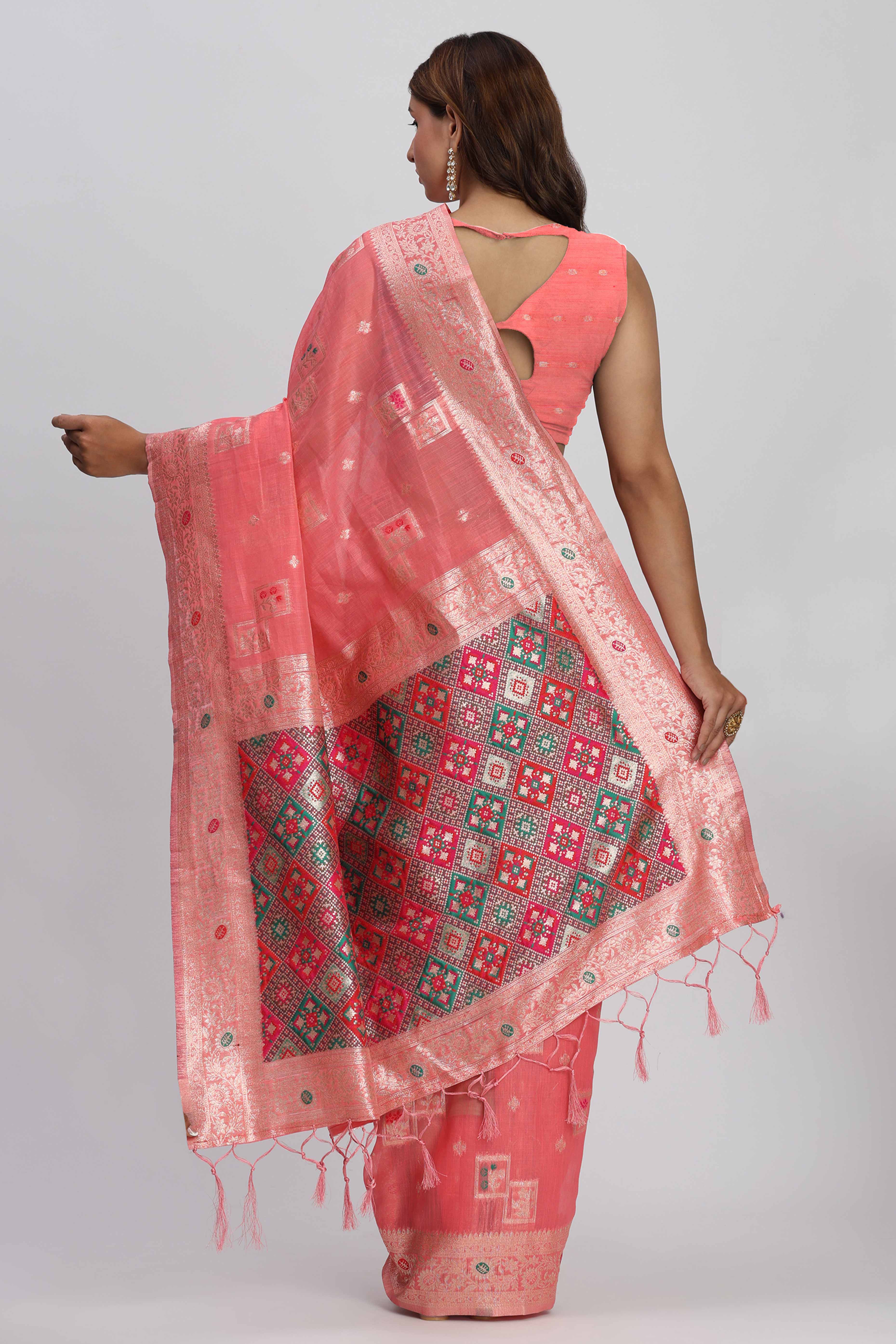 Floral Zari Weaving Brings Regal Beauty To This Coral Pink Linen Cotton Saree With Tassel Accents