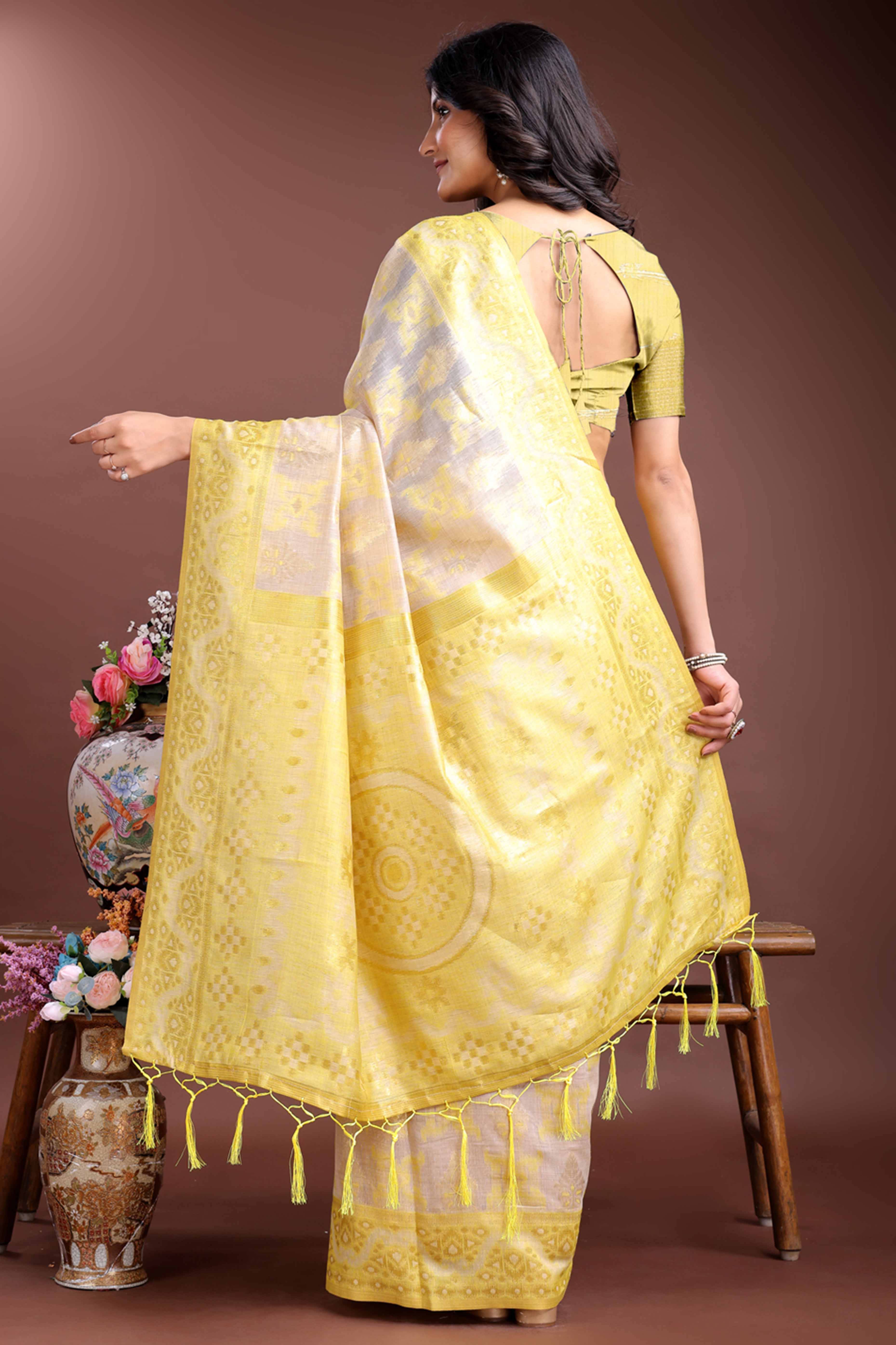 Radiant Yellow Traditional Ikkat Style Zari Weaving Cotton Blend Saree with Vibrant Tassel Embellishments
