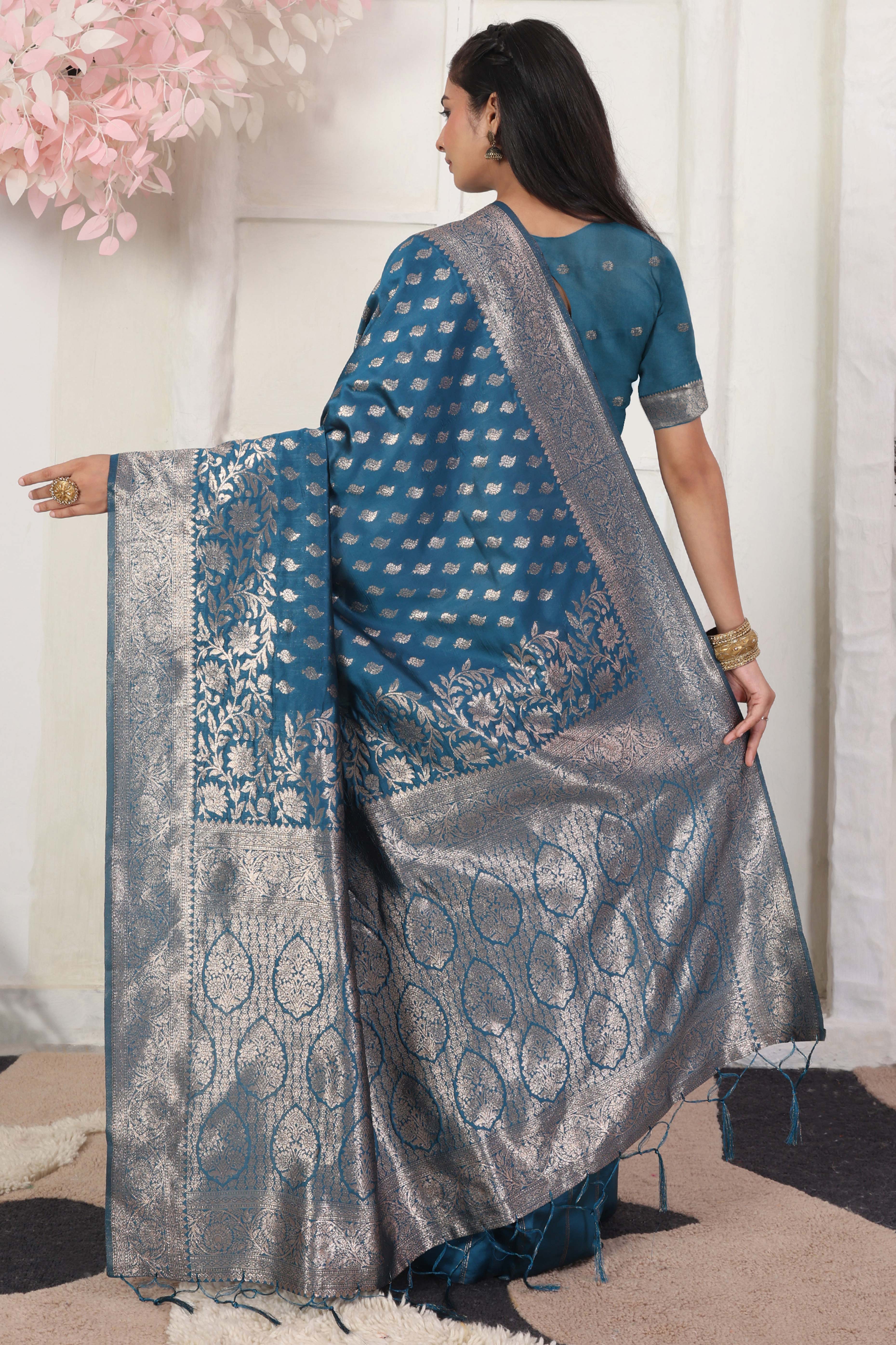 Blue Traditional Lichi Silk Blend Saree Enhanced With Floral Zari Weaving & Tassel Pallu