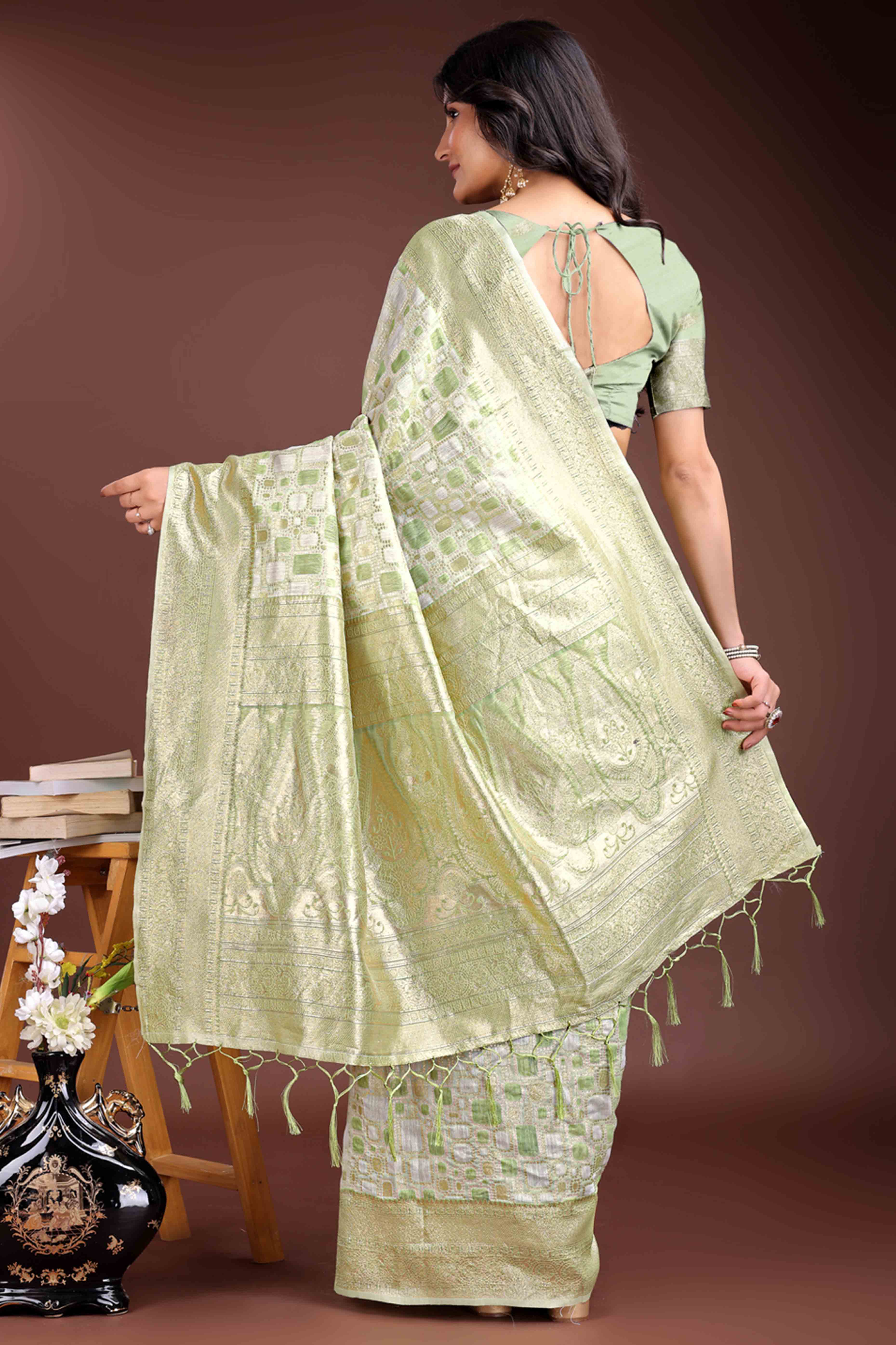 Stunning Light Green Geometric Style Zari Weaving Cotton Blend Saree Adorned with Exquisite Tassels