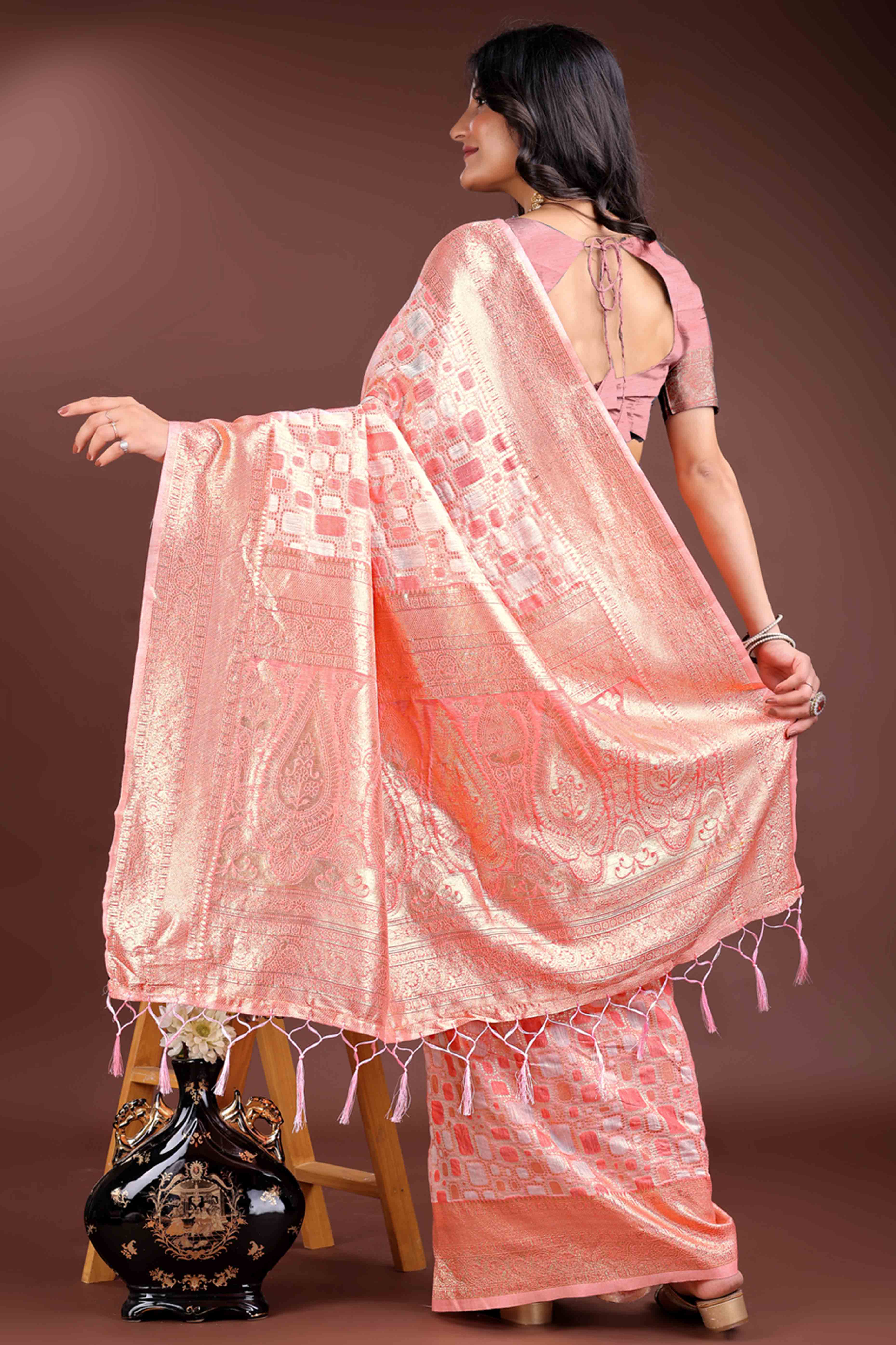Delightful Peach Geometric Style Zari Weaving Cotton Blend Saree Embellished with Stylish Tassels