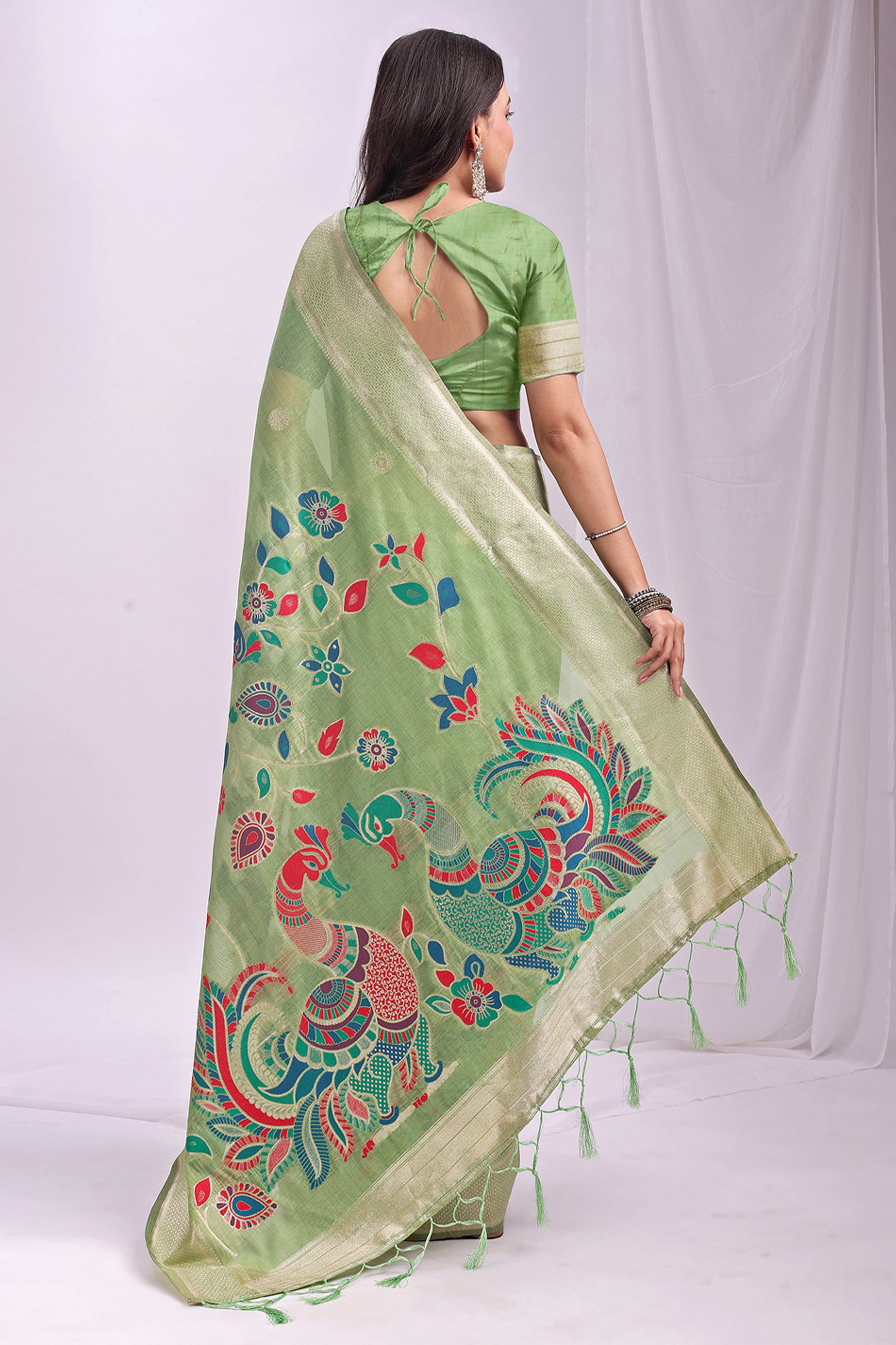 Light Green Floral Woven Linen Cotton Saree Accented With Peacock Motif Pallu & Zari Border