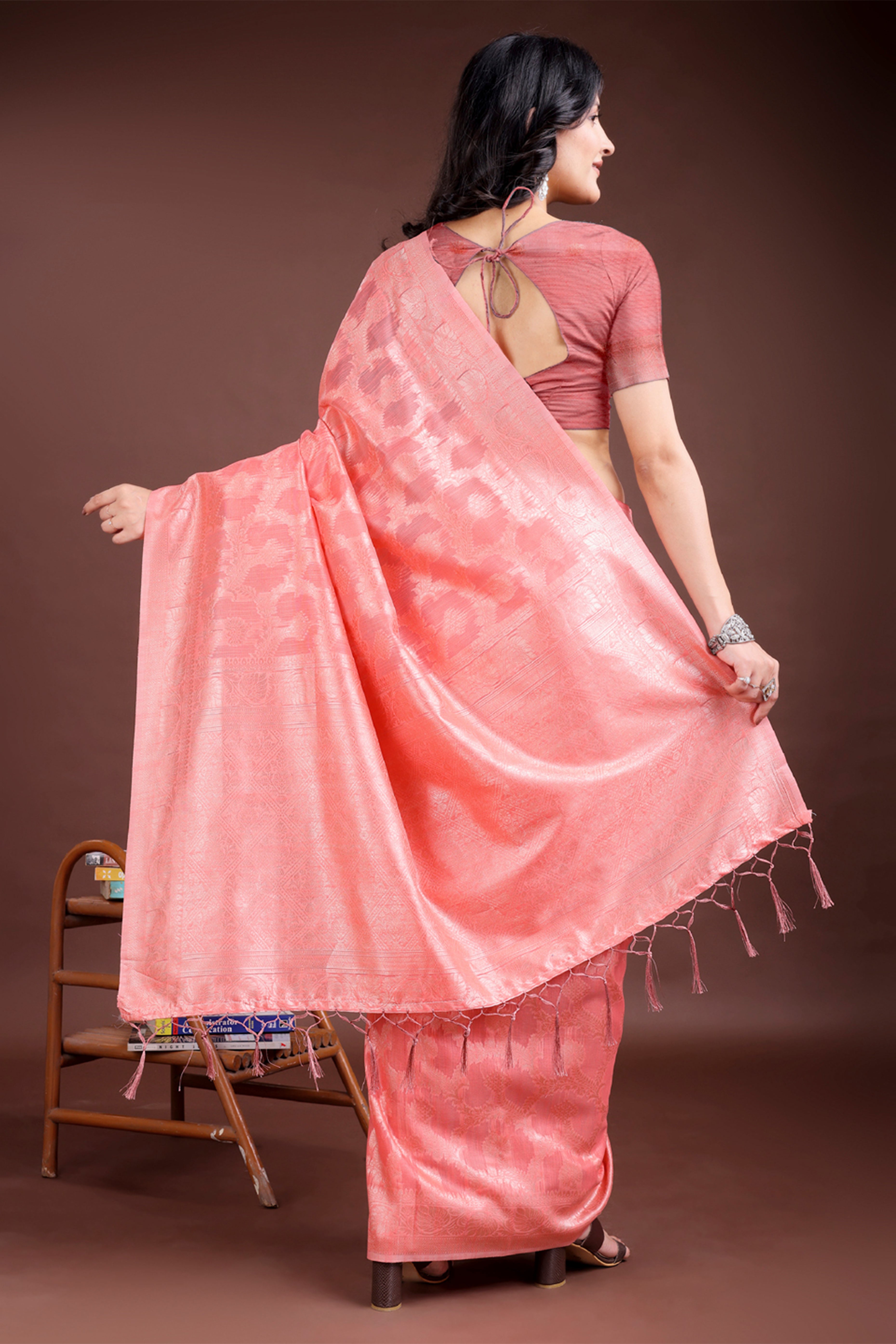 Peach Linen Cotton Saree with Lustrous Zari Borders and Elegant Tassel Accents