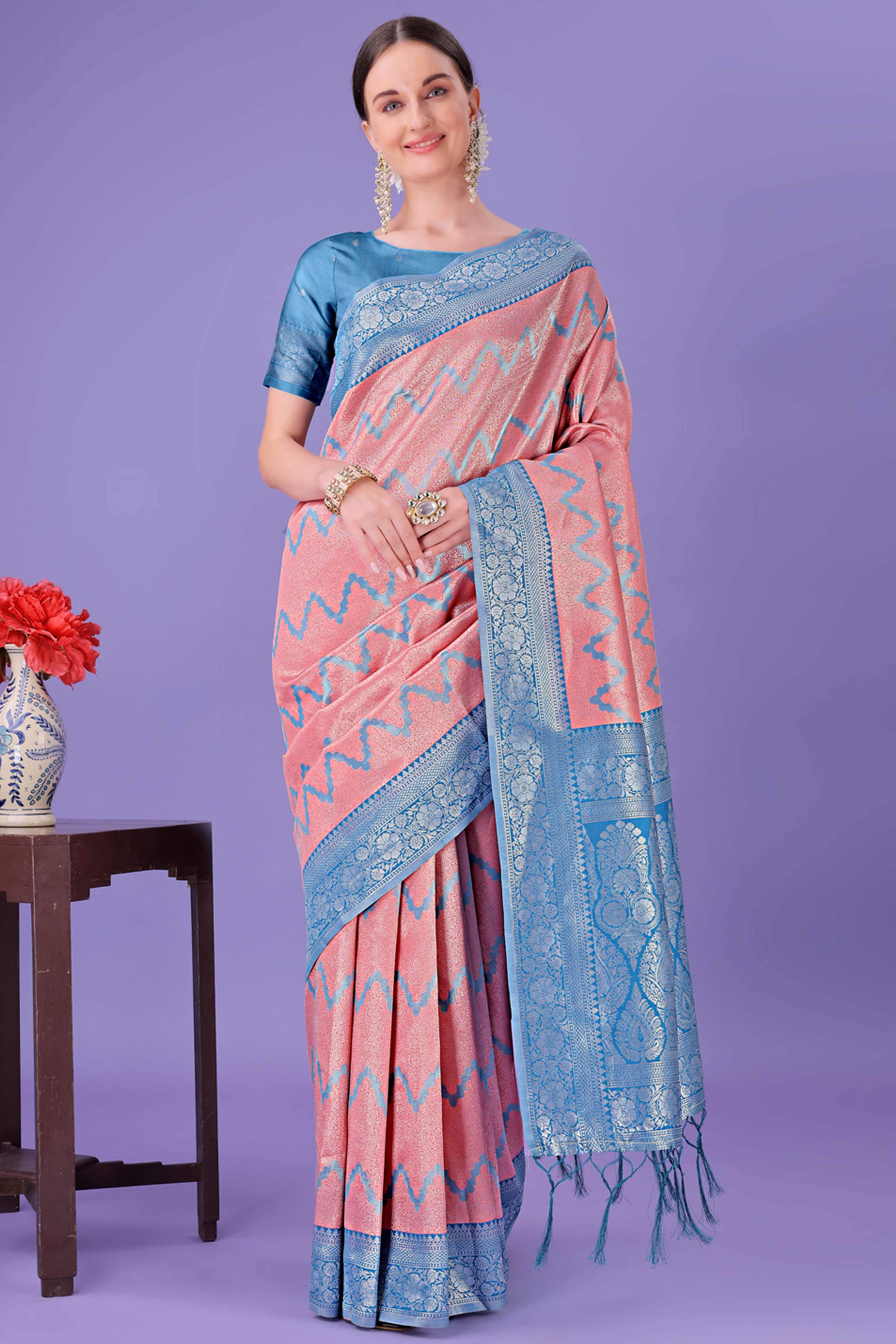 Peach Lichi Cotton Silk Saree Adorned With Floral Zari Weave & Tassels