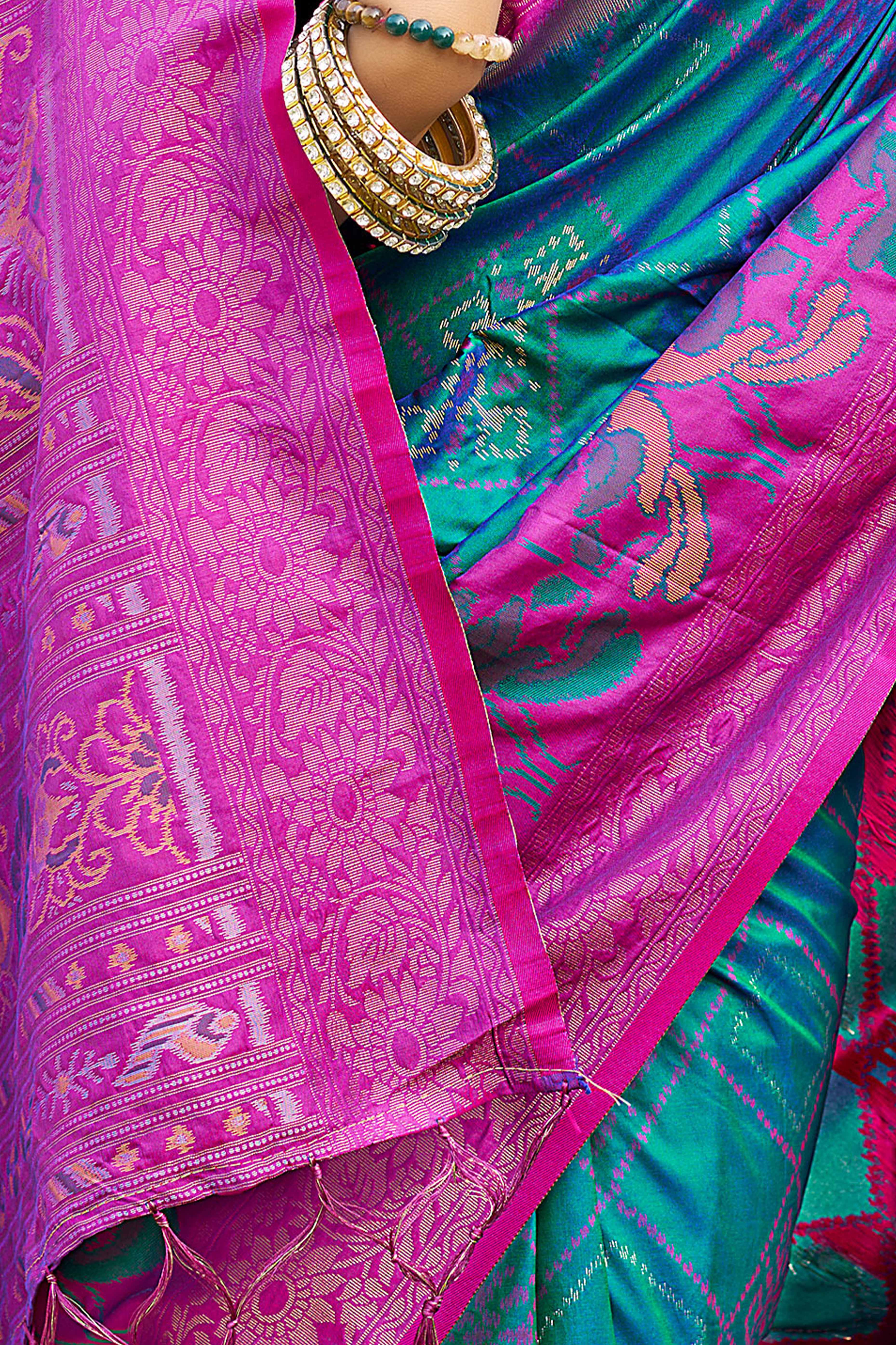 Graceful Morpich Blue Pochampally Silk Blend Saree Adorned With Floral Weaving & Tassel Pallu