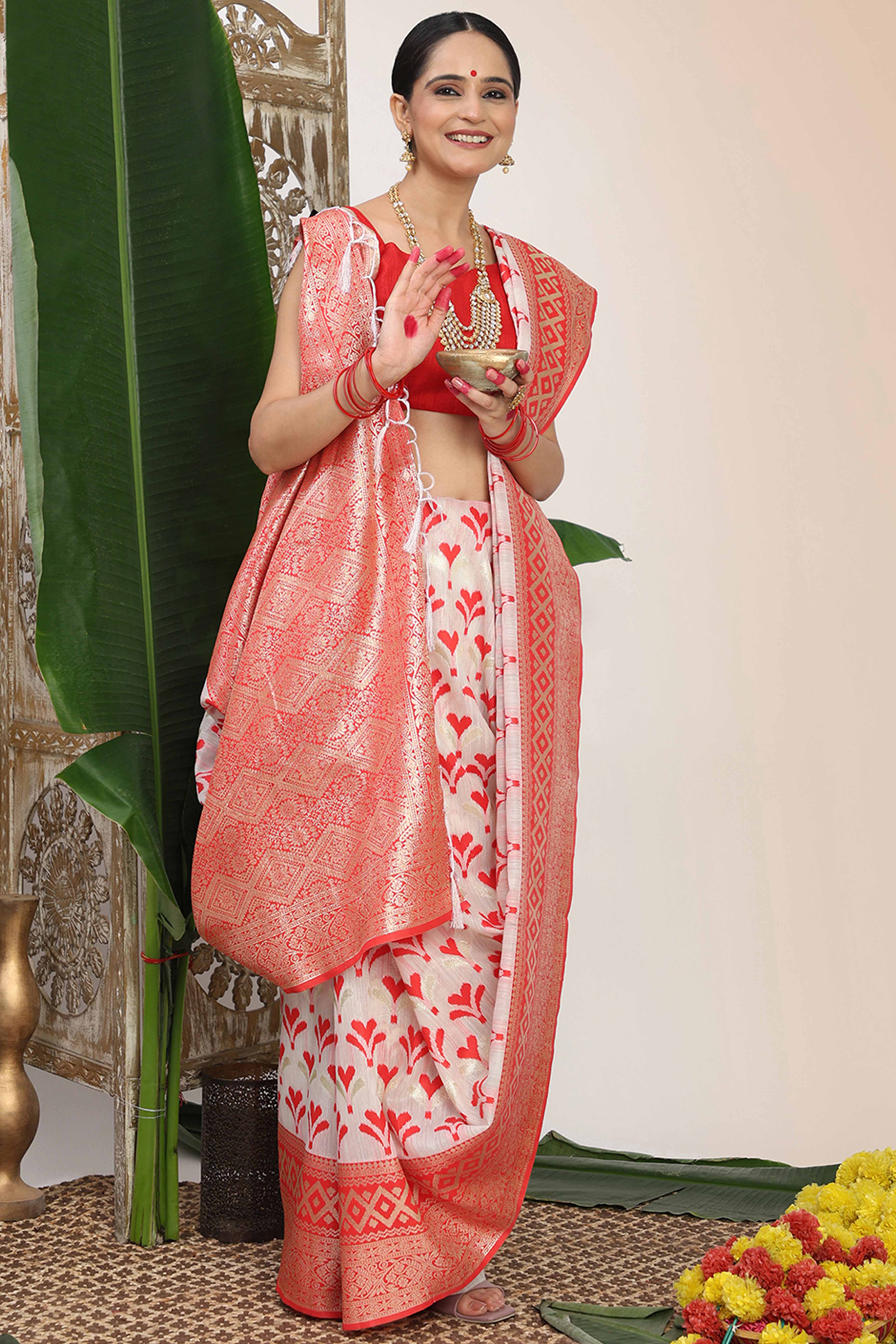 White & Red Fusion Linen Cotton Saree With Classic Zari Weaving And Soft Tassel Accents