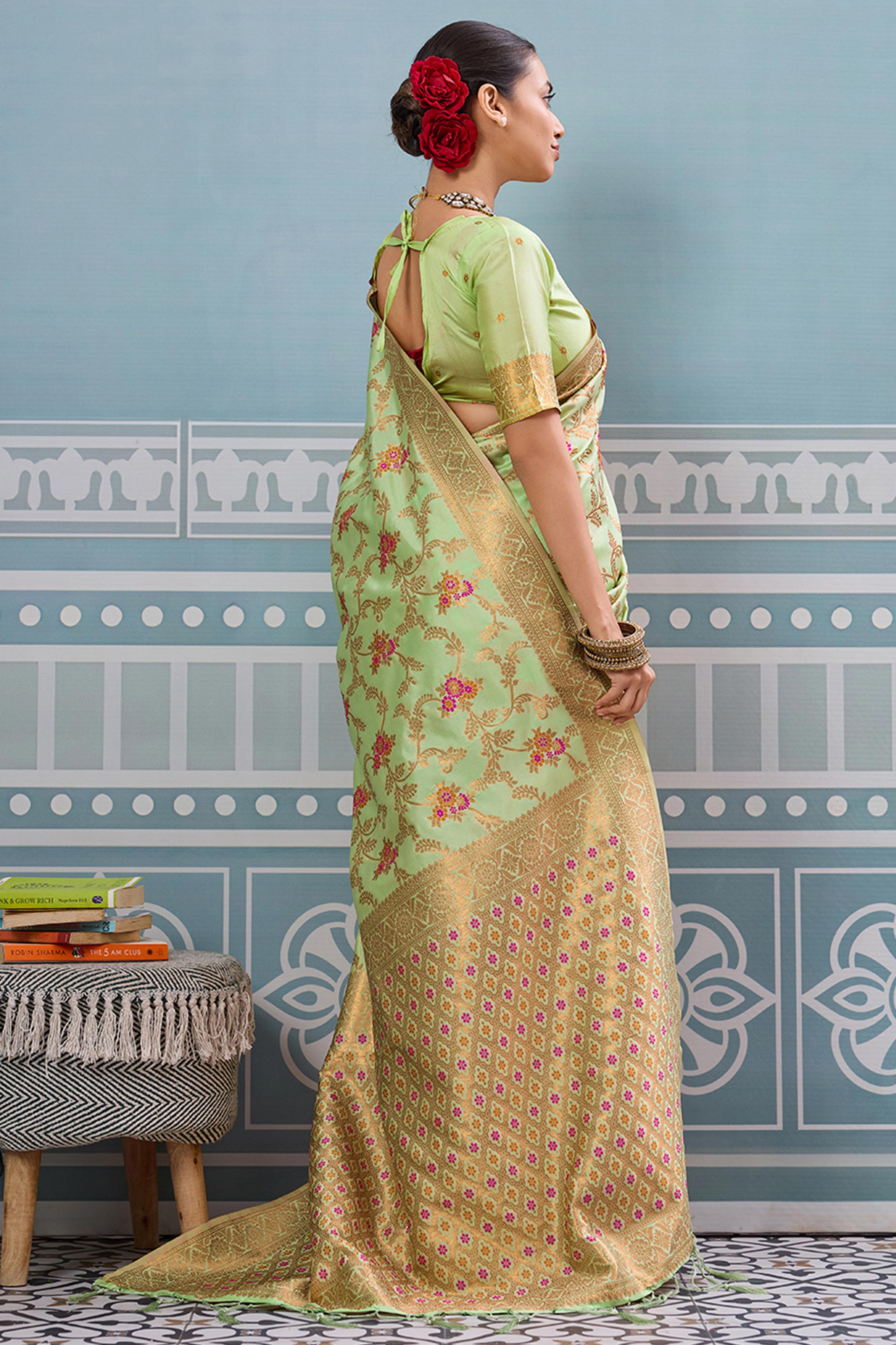 Majestic Bloom Pista Green Floral Zari Weaving Silk Blend Saree With Elegant Tassel Pallu