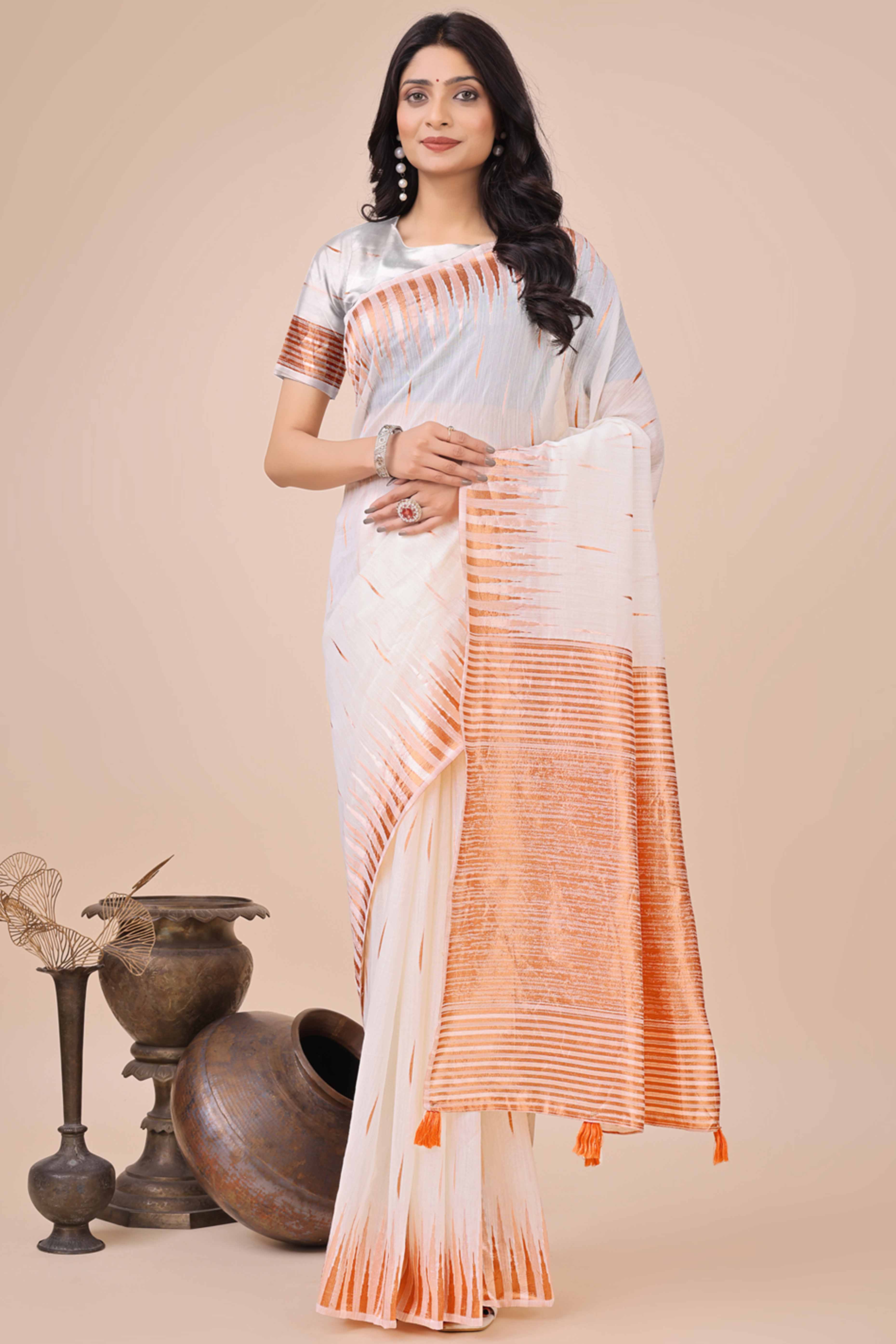 White Saree In Linen Cotton With Exquisite Zari Weaving & Subtle Tassel Border