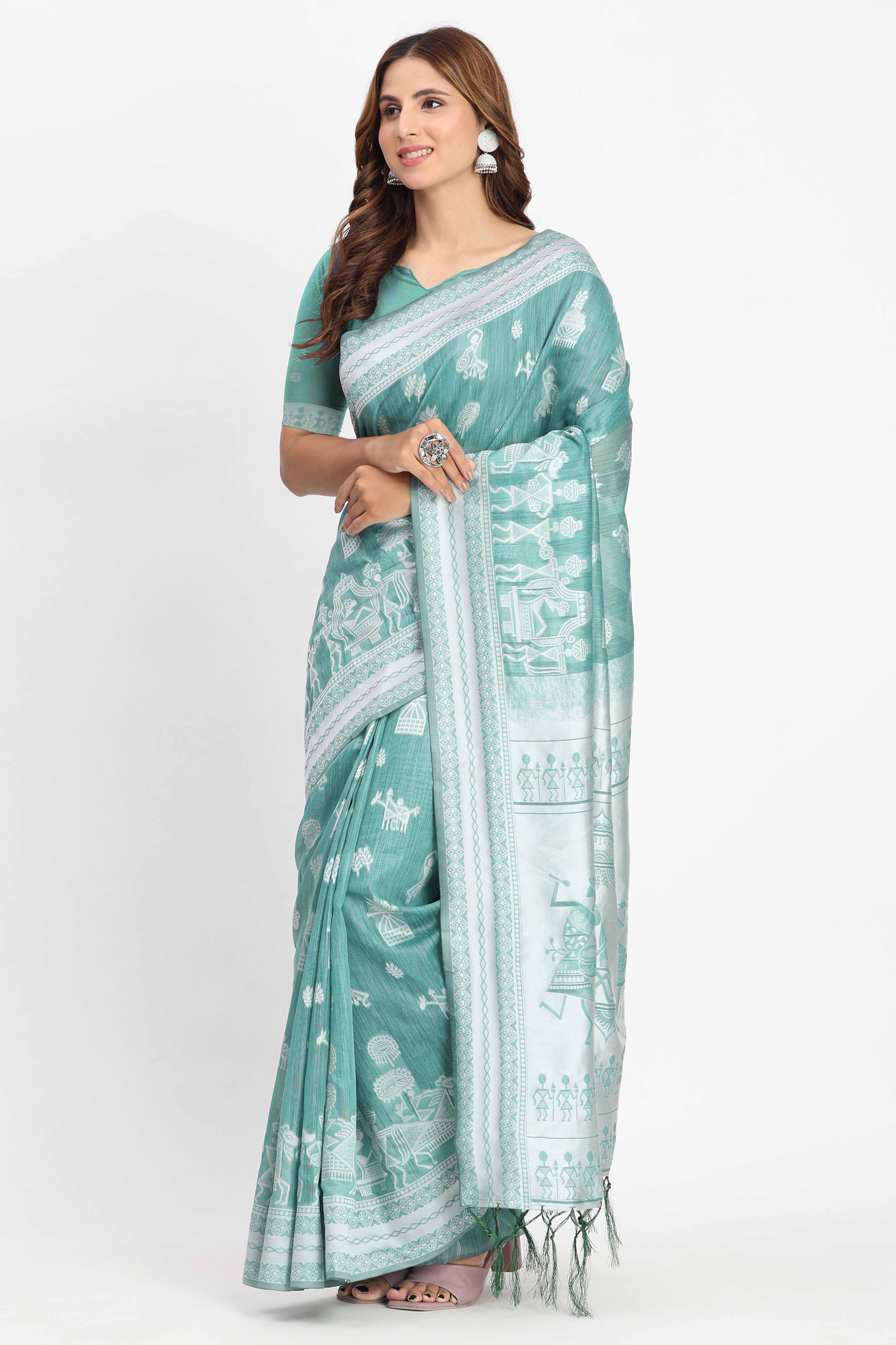 Pastel Sea Green Linen Cotton Saree Showcasing Warli Motifs In Zari Weaving With Tassel Pallu