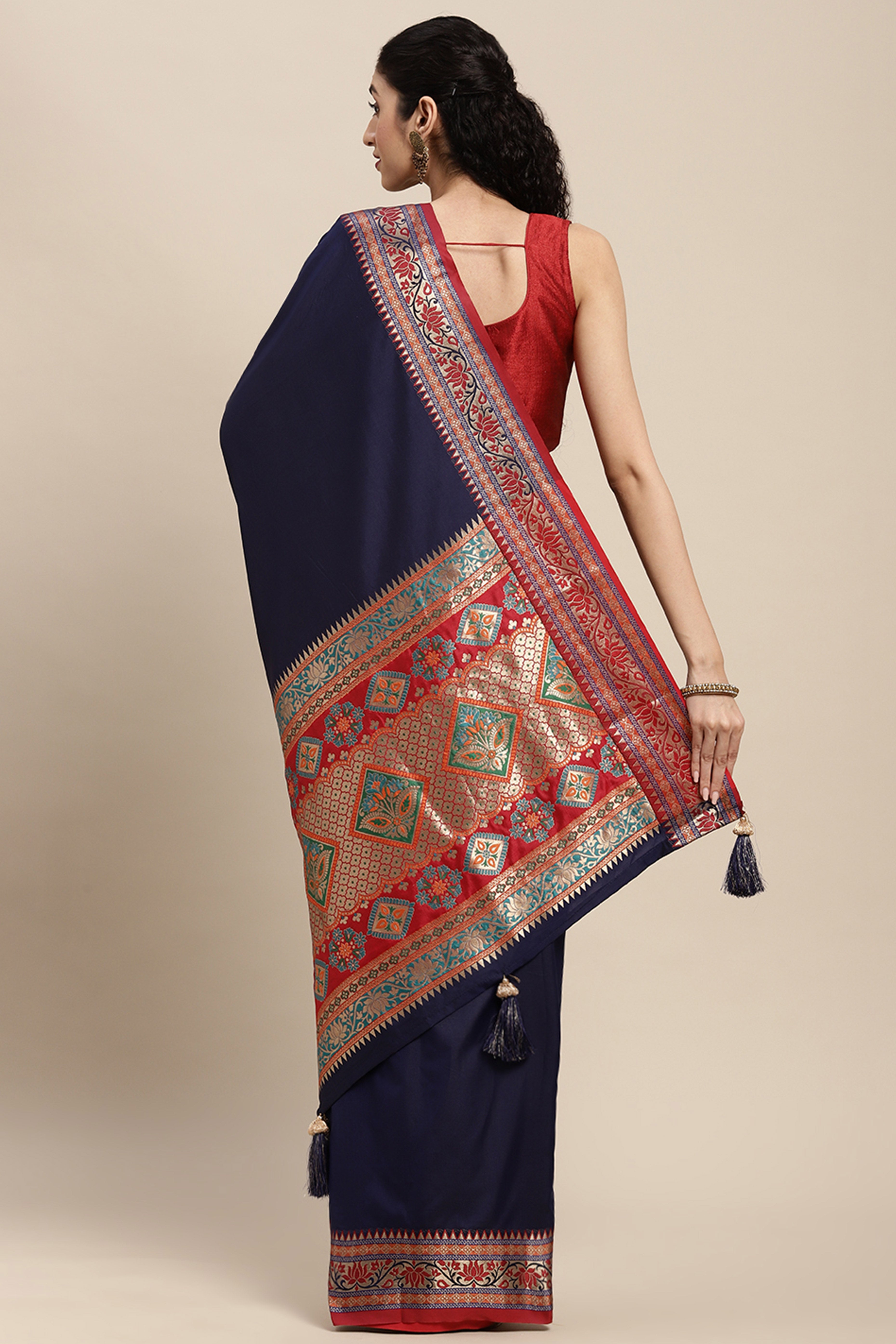 Graceful Navy Blue Solid Saree Highlighted With Floral Zari Weaving On Silk Blend & Tassel Pallu