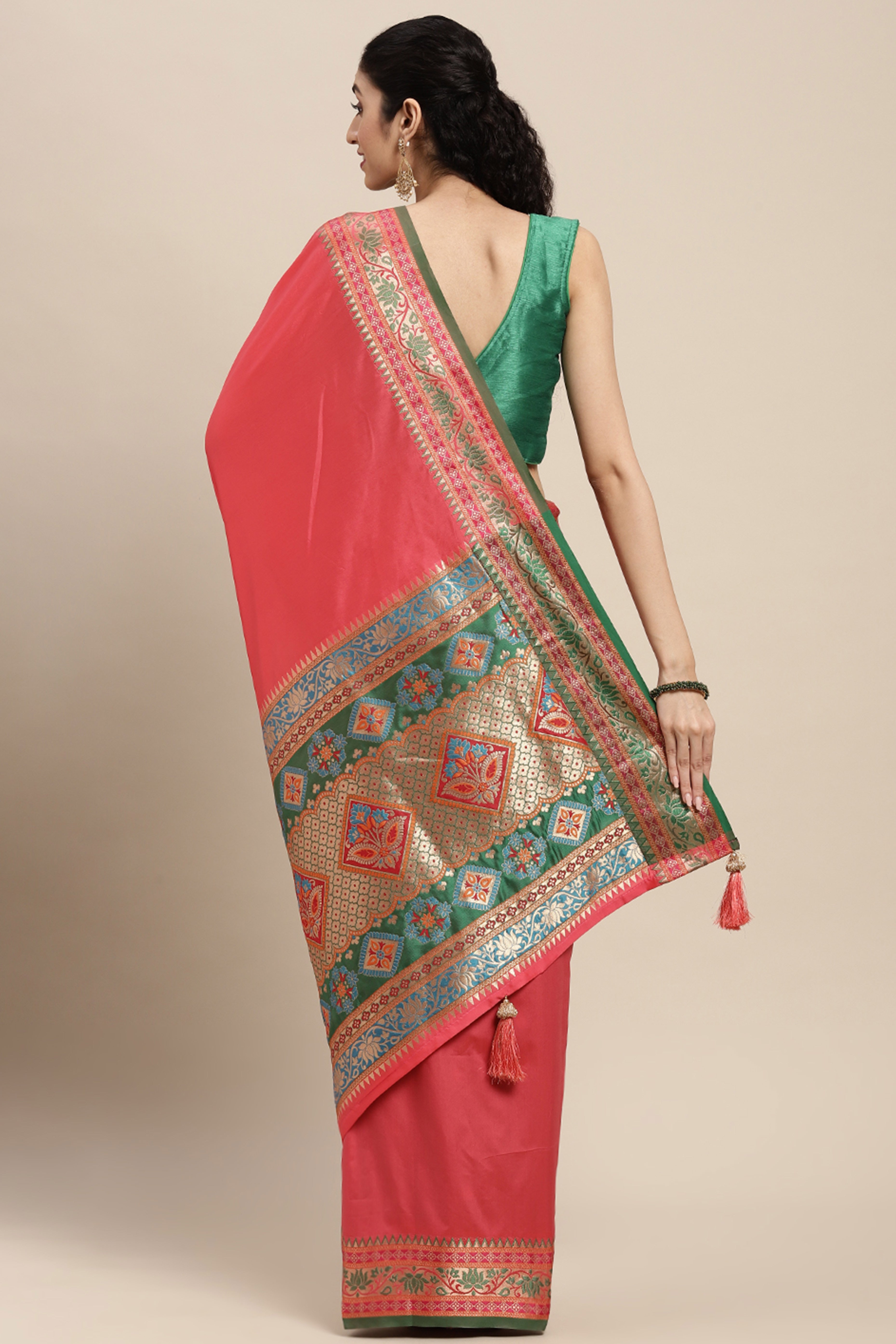 Graceful Gajari Pink Solid Saree Highlighted With Floral Zari Weaving On Silk Blend & Tassel Pallu