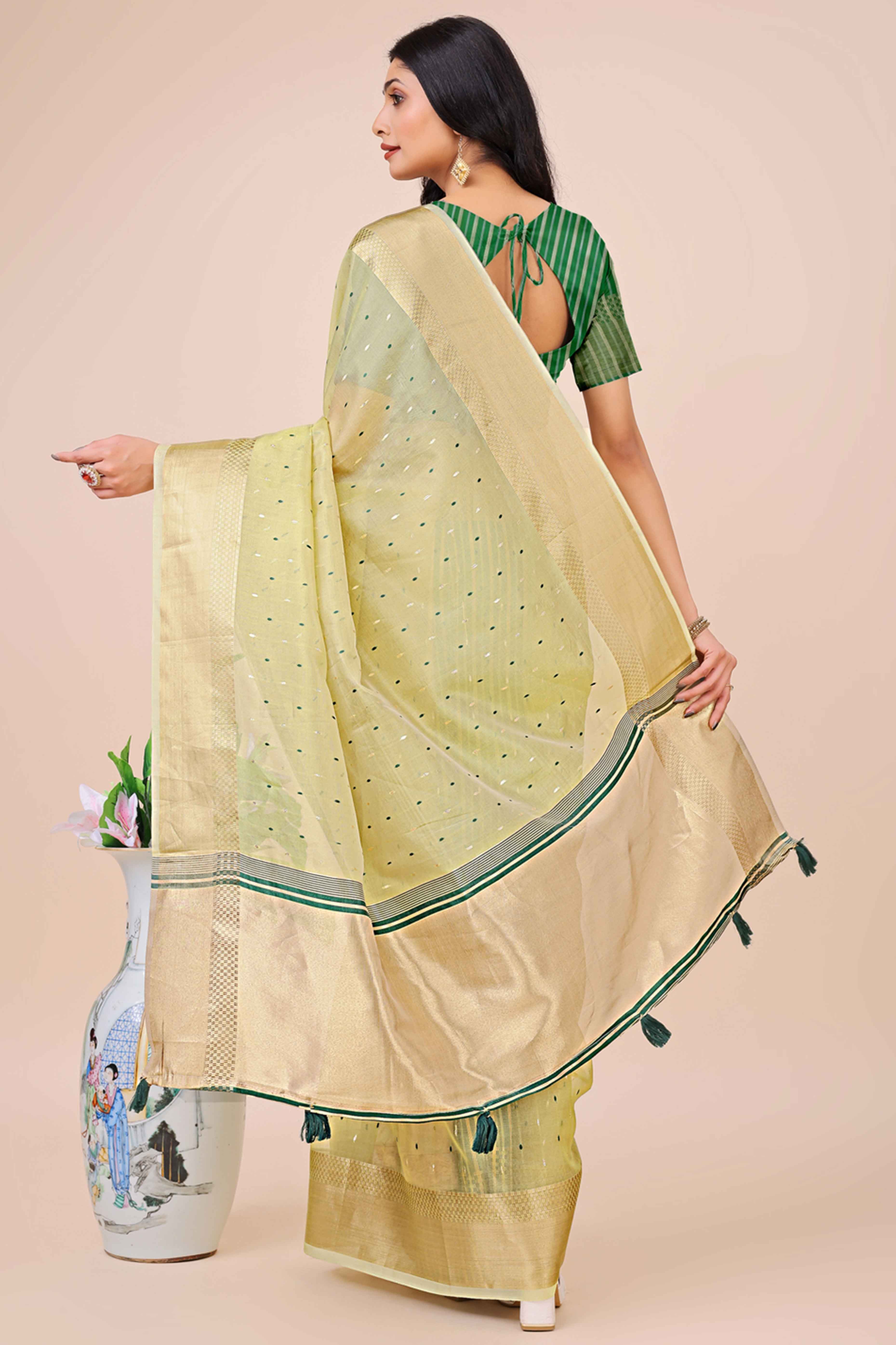 Light Green Organza Saree Adorned With Fine Zari Weaving & Stylish Tassel Edging