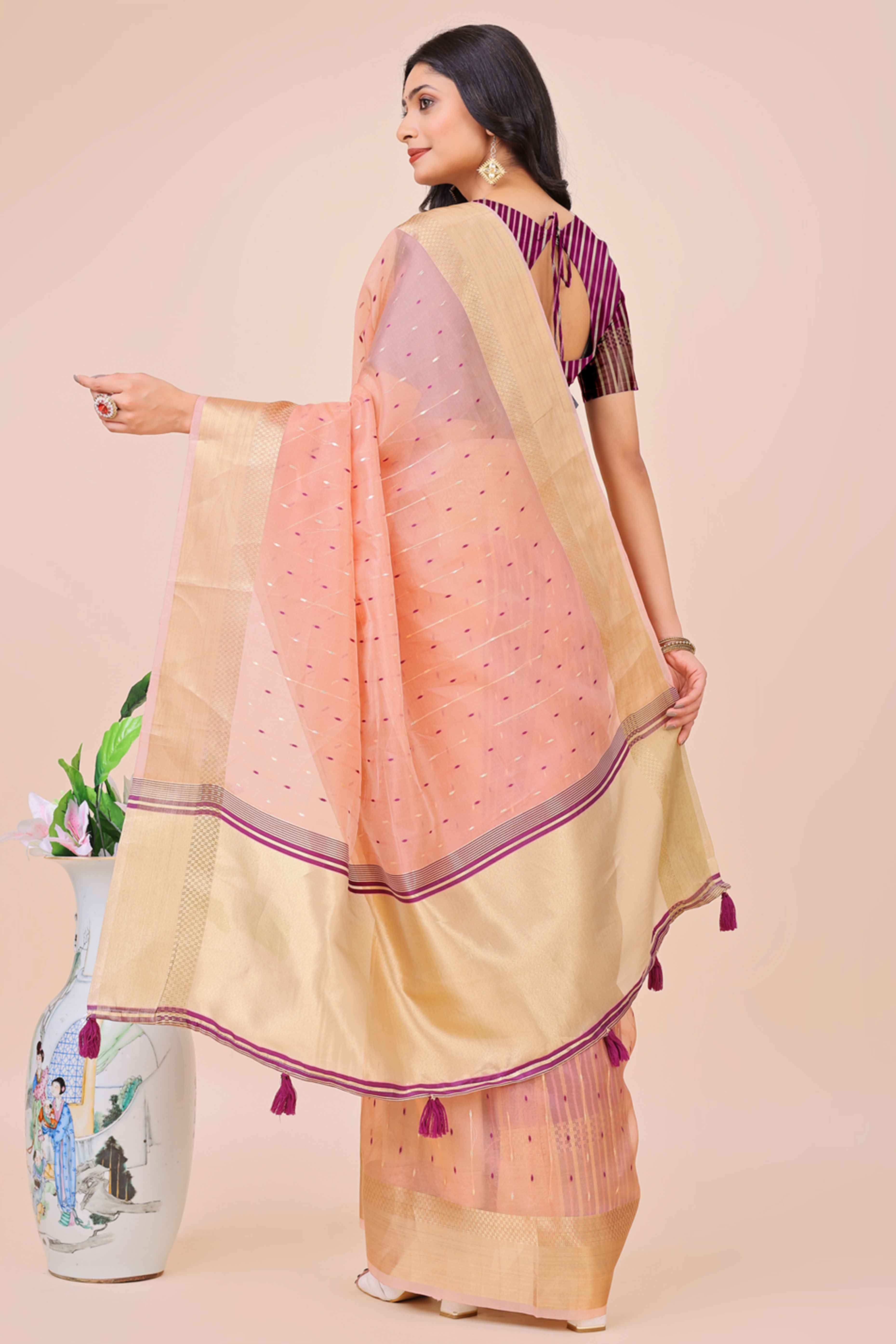 Light Pink Organza Saree Adorned With Fine Zari Weaving & Stylish Tassel Edging