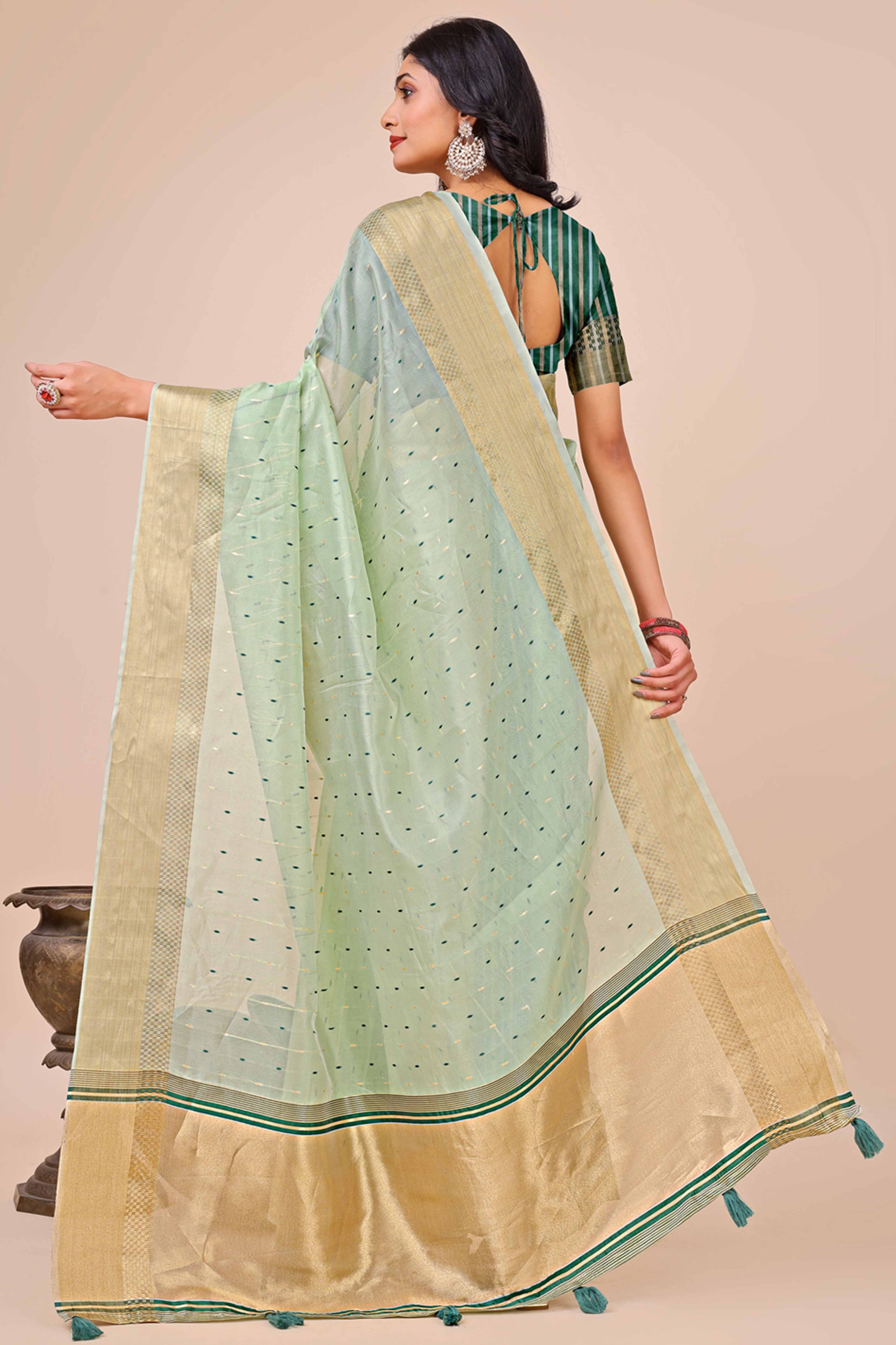 Sea Green Organza Saree Adorned With Fine Zari Weaving & Stylish Tassel Edging