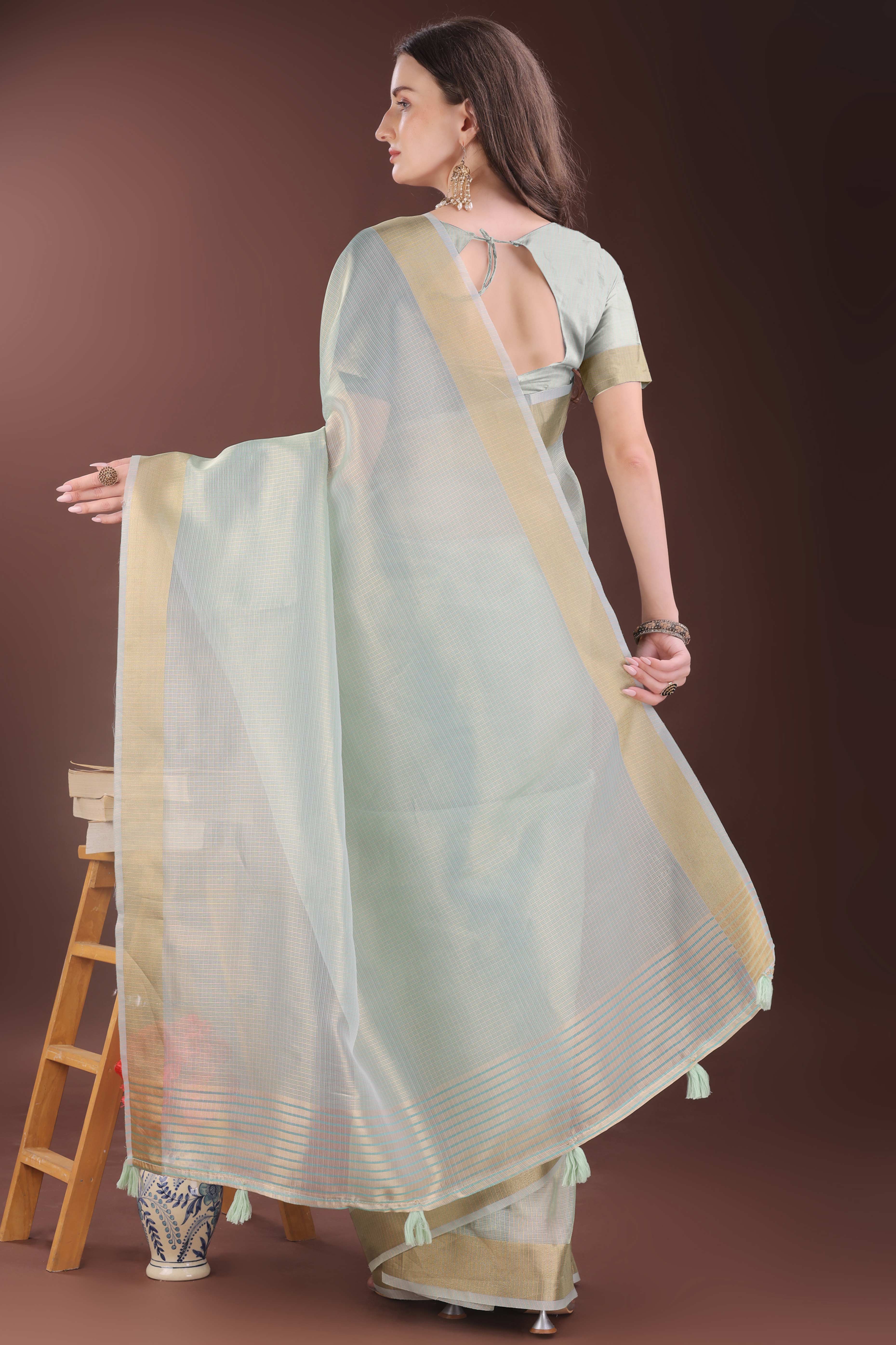 Sea Green Zari Woven Organza Saree With Graceful Tassel Border