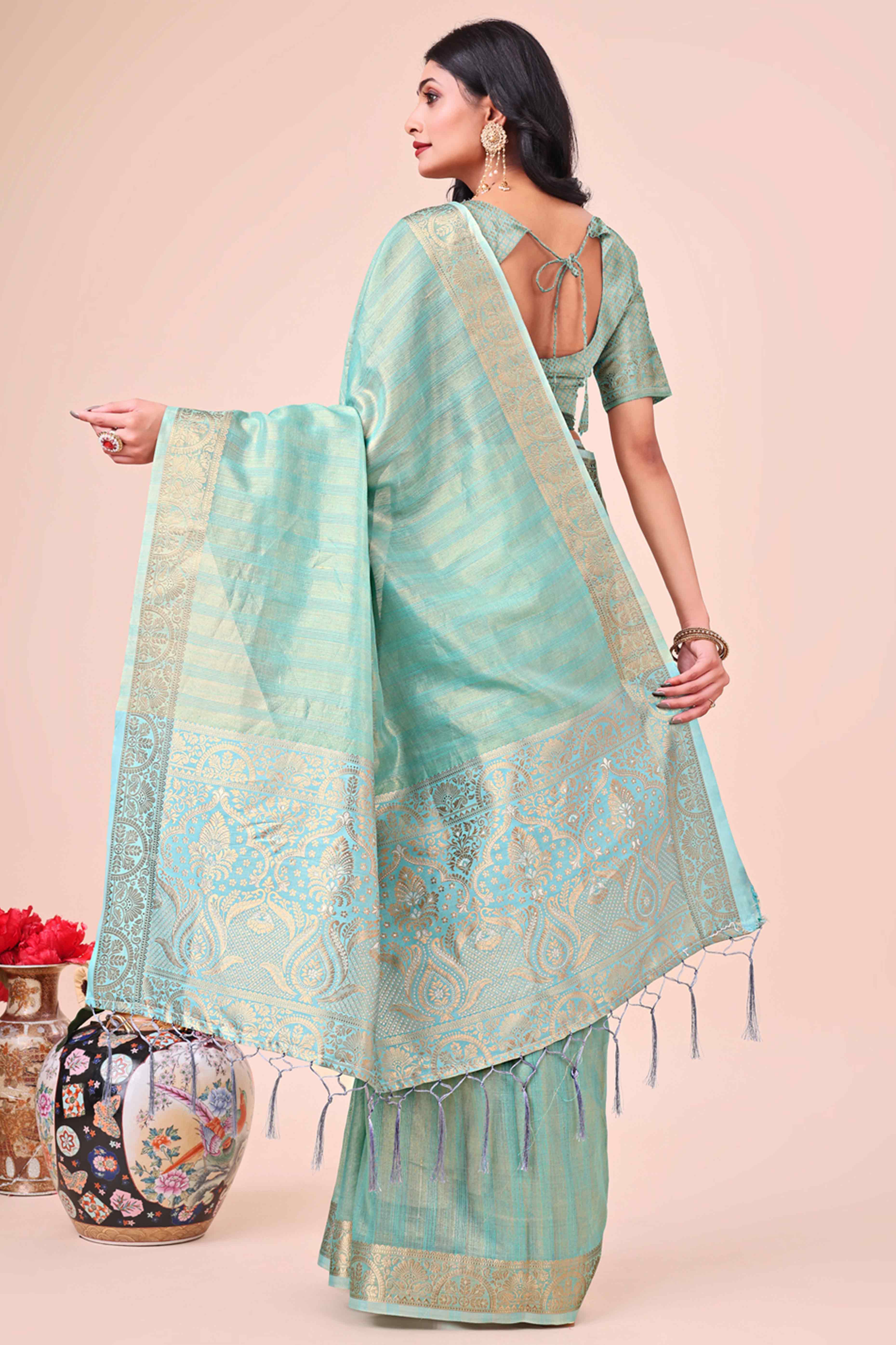Turquoise Organza Saree With Floral Zari Weave & Tassel Accents