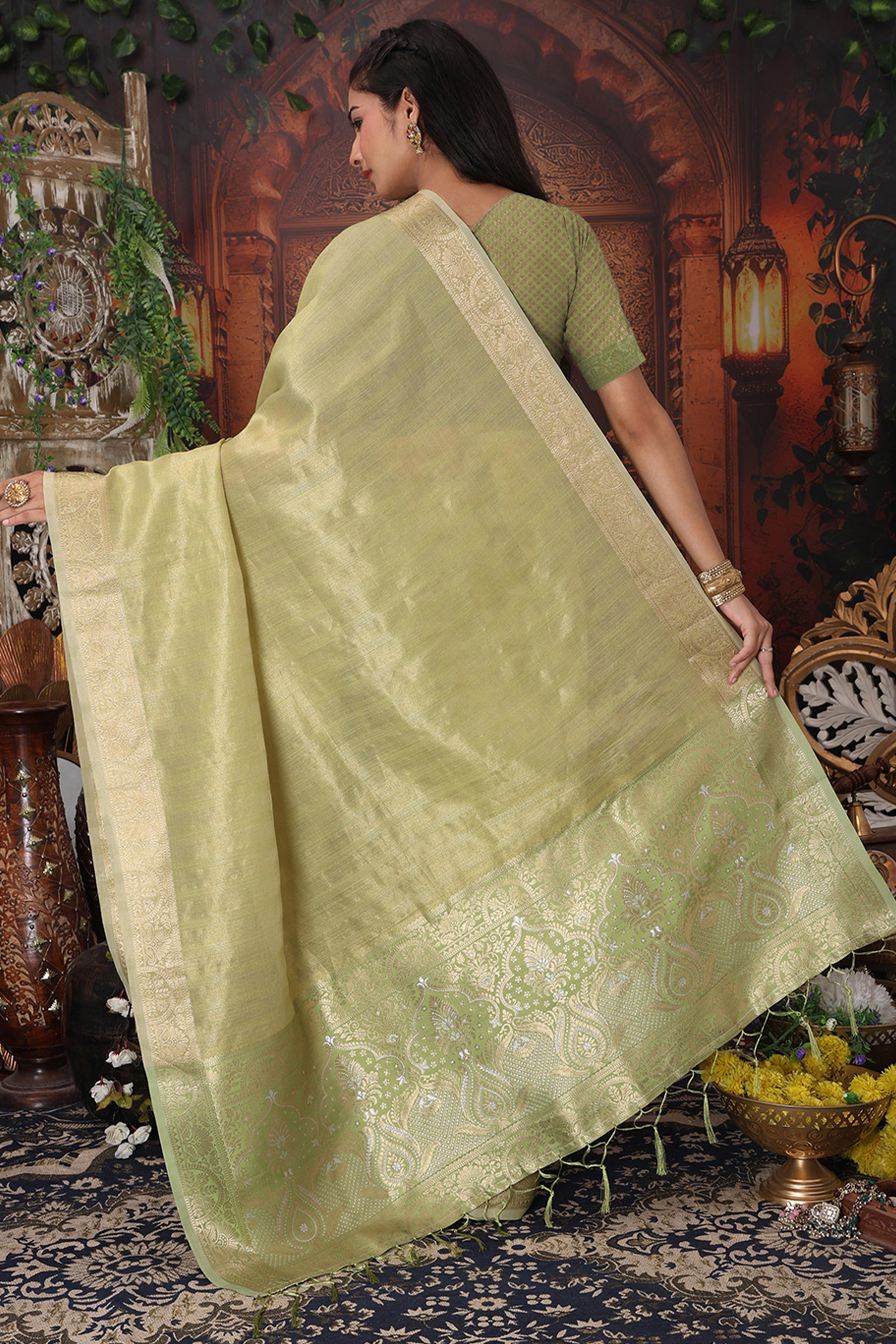 Green Organza Saree Adorned With Floral Zari Weaving & Graceful Tassel Pallu