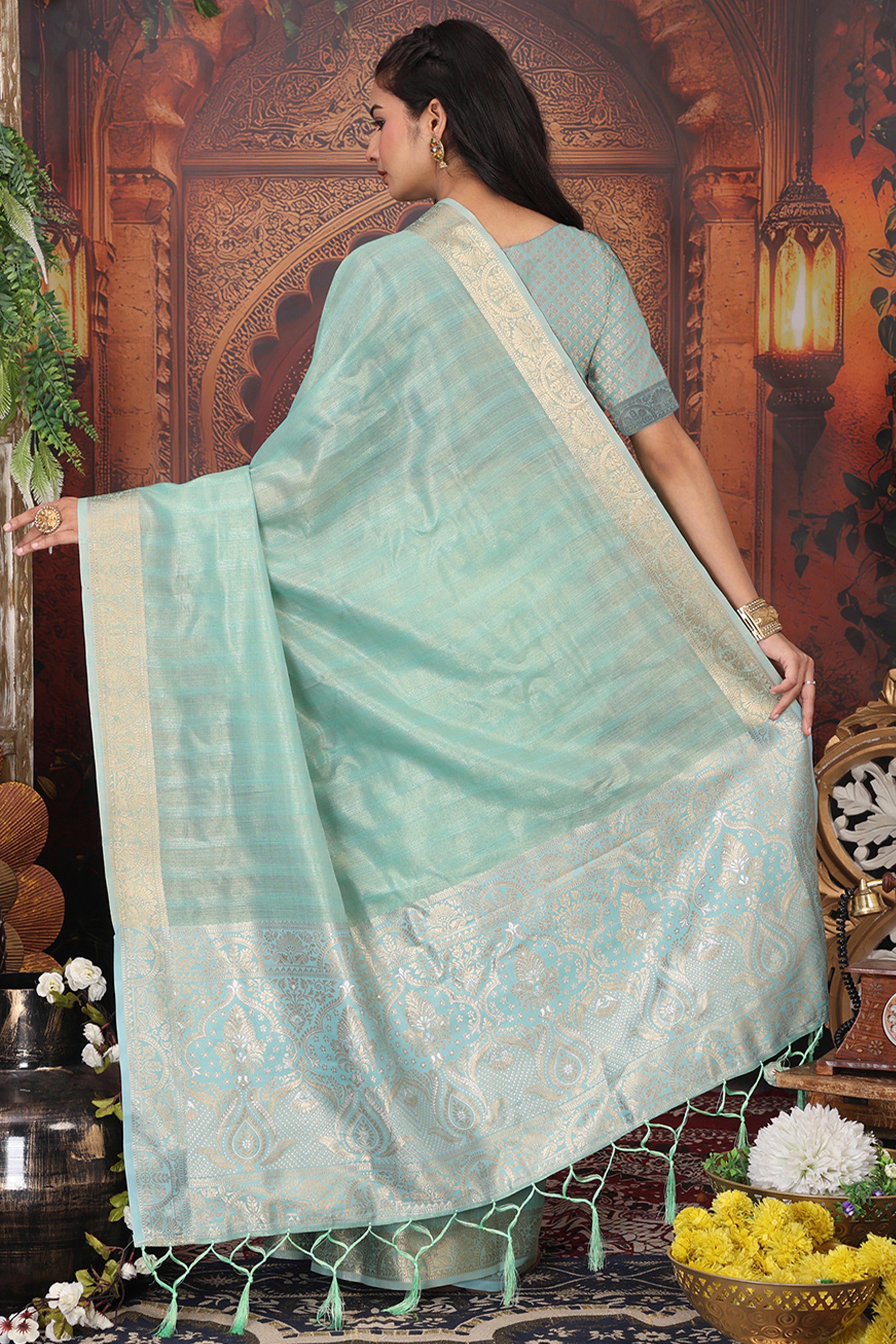 Turquoise Organza Saree Adorned With Floral Zari Weaving & Graceful Tassel Pallu
