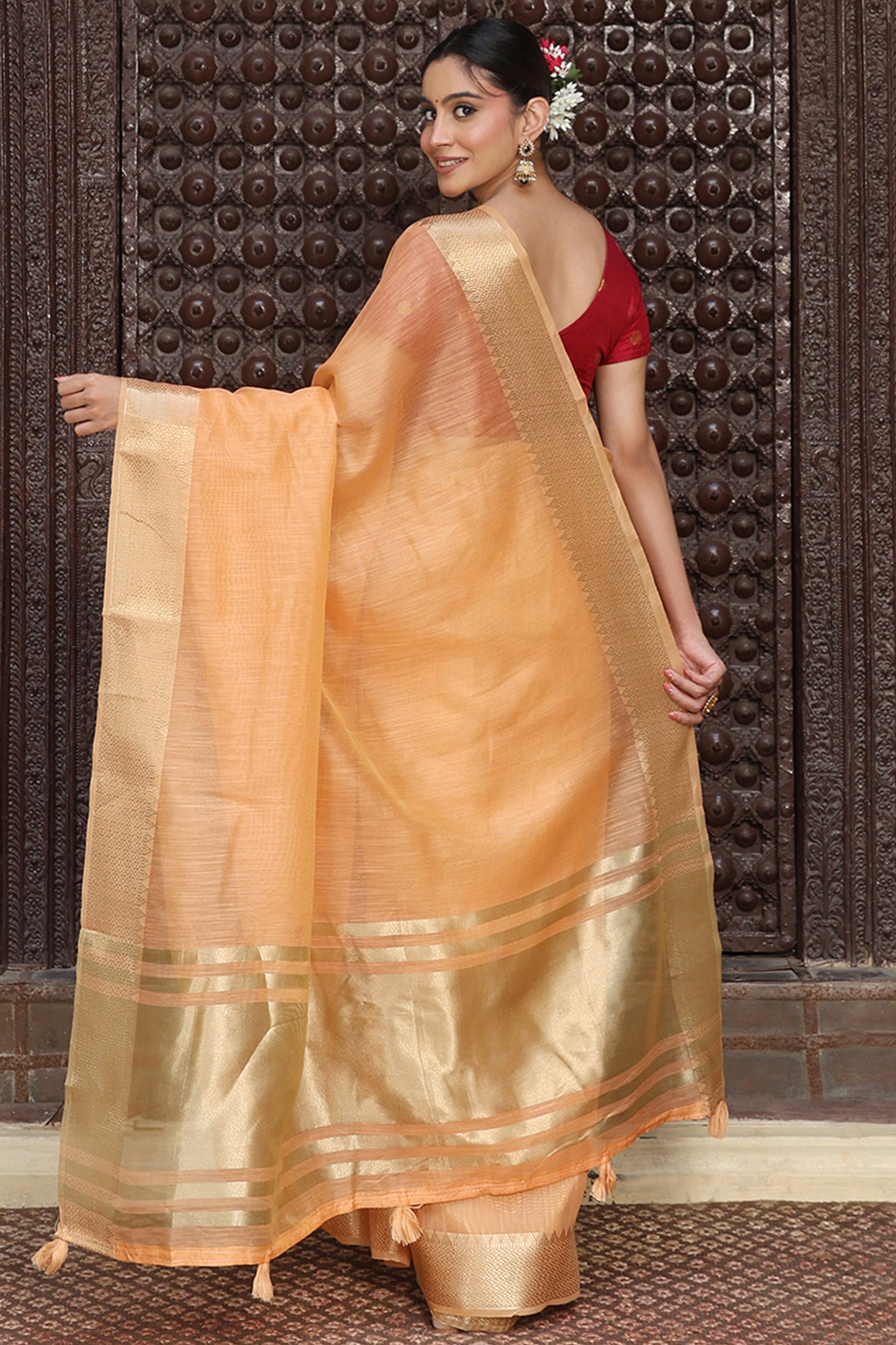 Trendy Orange Cotton Blend Saree Showcasing Elegant Zari Weaving & Tassel Border Pallu