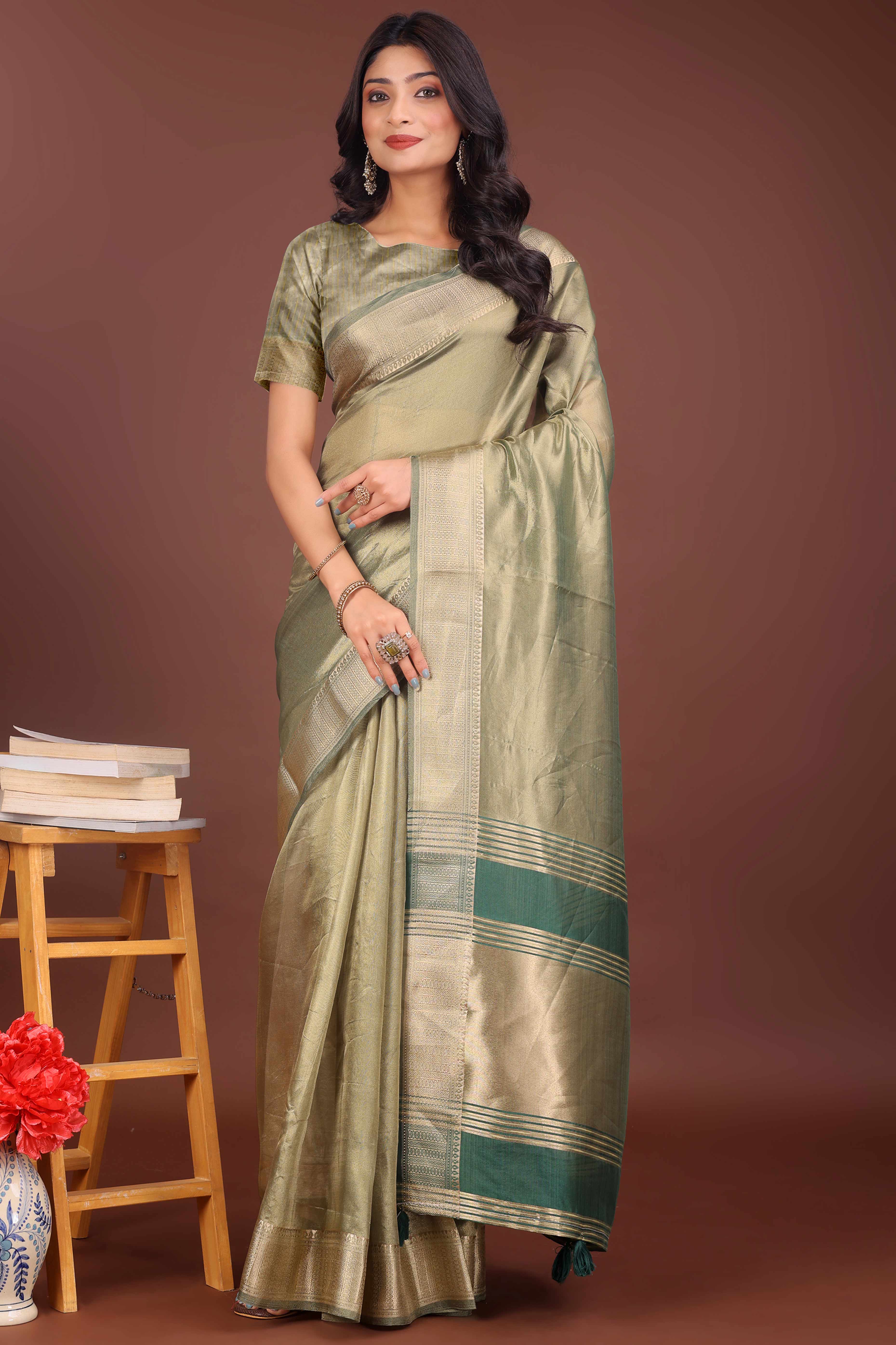 Green Organza Solid Saree With Lustrous Zari Weave &  Delicate Tassels